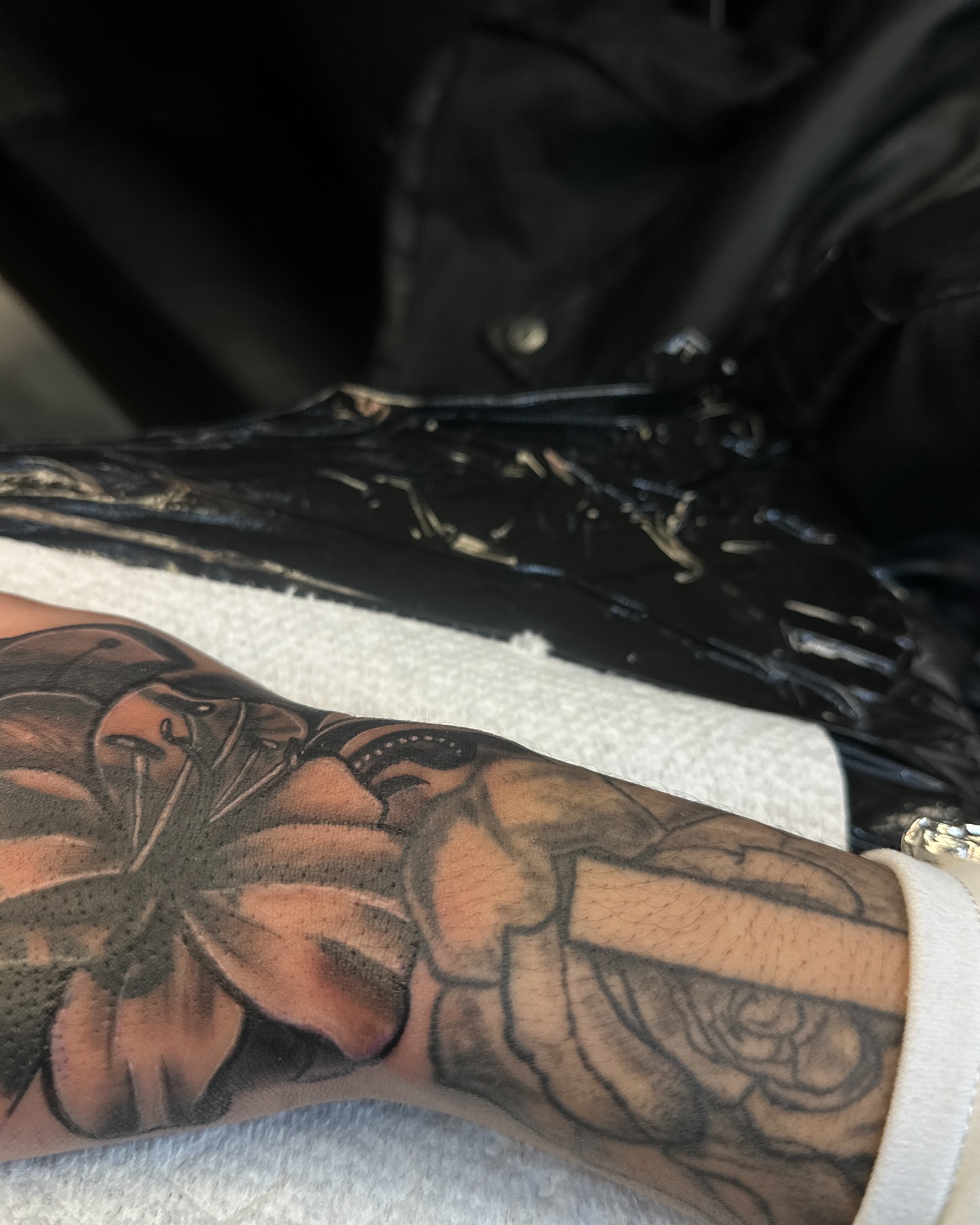 Muscular figure black and grey tattoo on the forearm by ᴡᴏʀᴍ