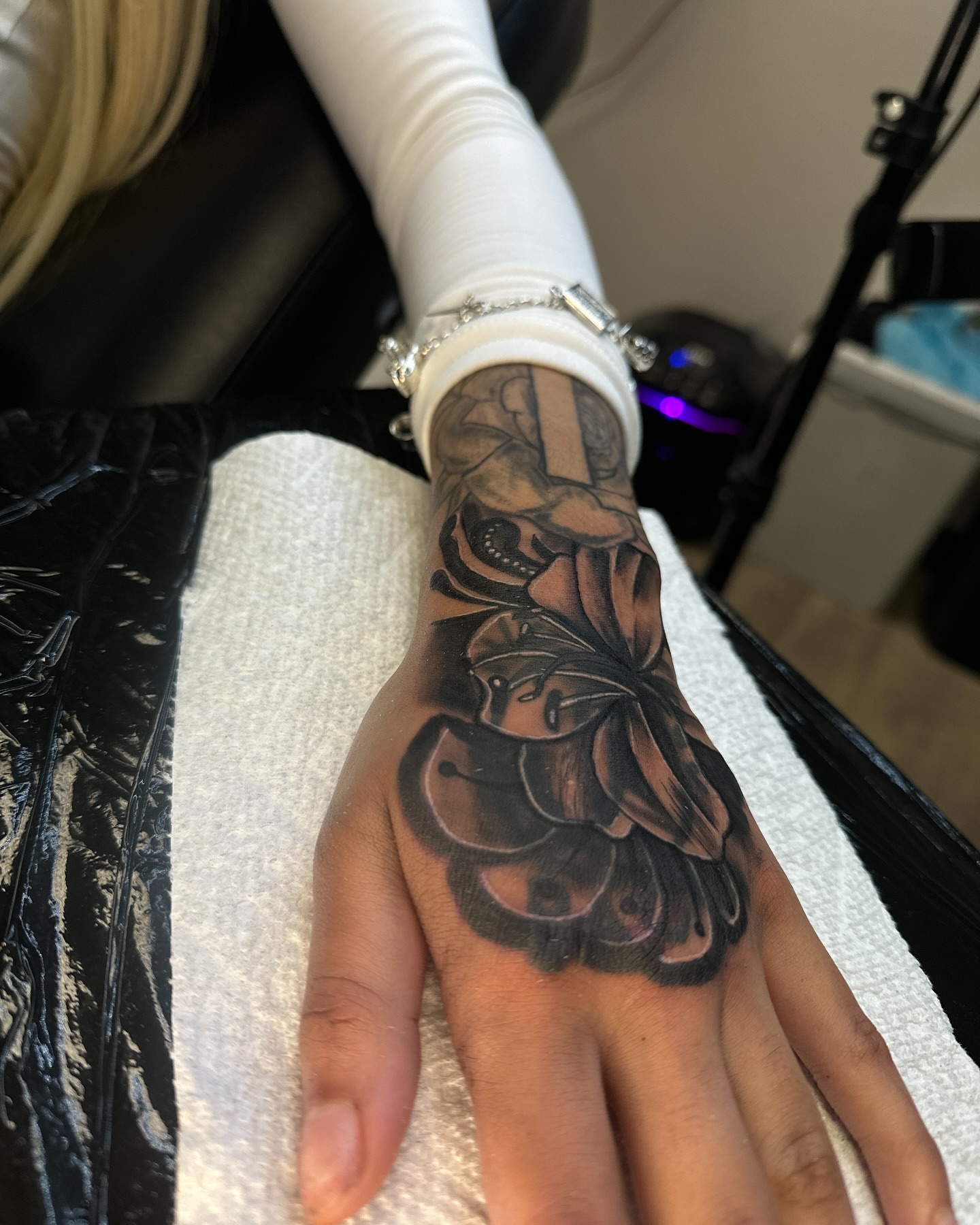 Flower black and grey tattoo on the hand by ᴡᴏʀᴍ