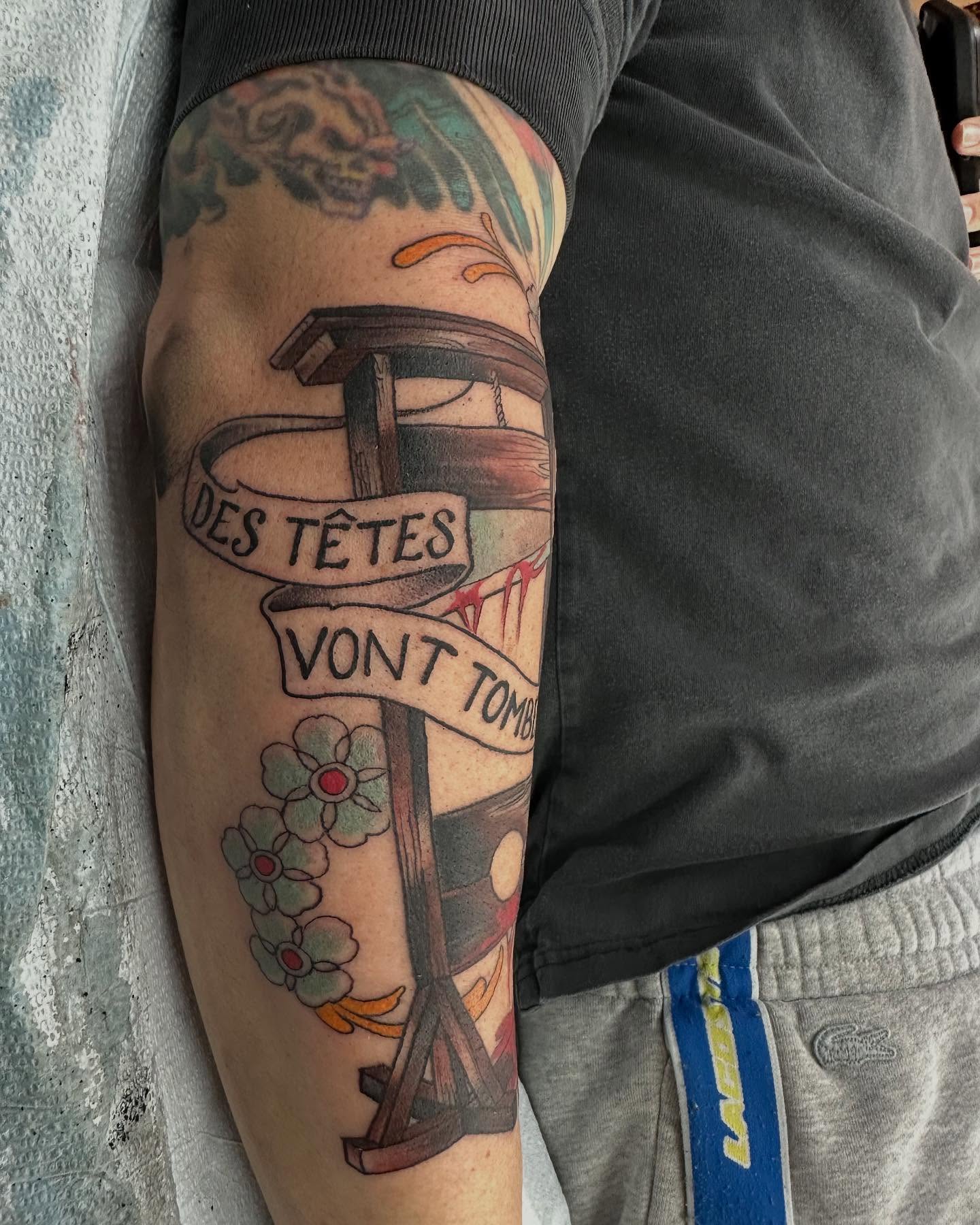 Cross with banner American traditional tattoo on the forearm by Hori Bensei, Charlottesville, Virginia