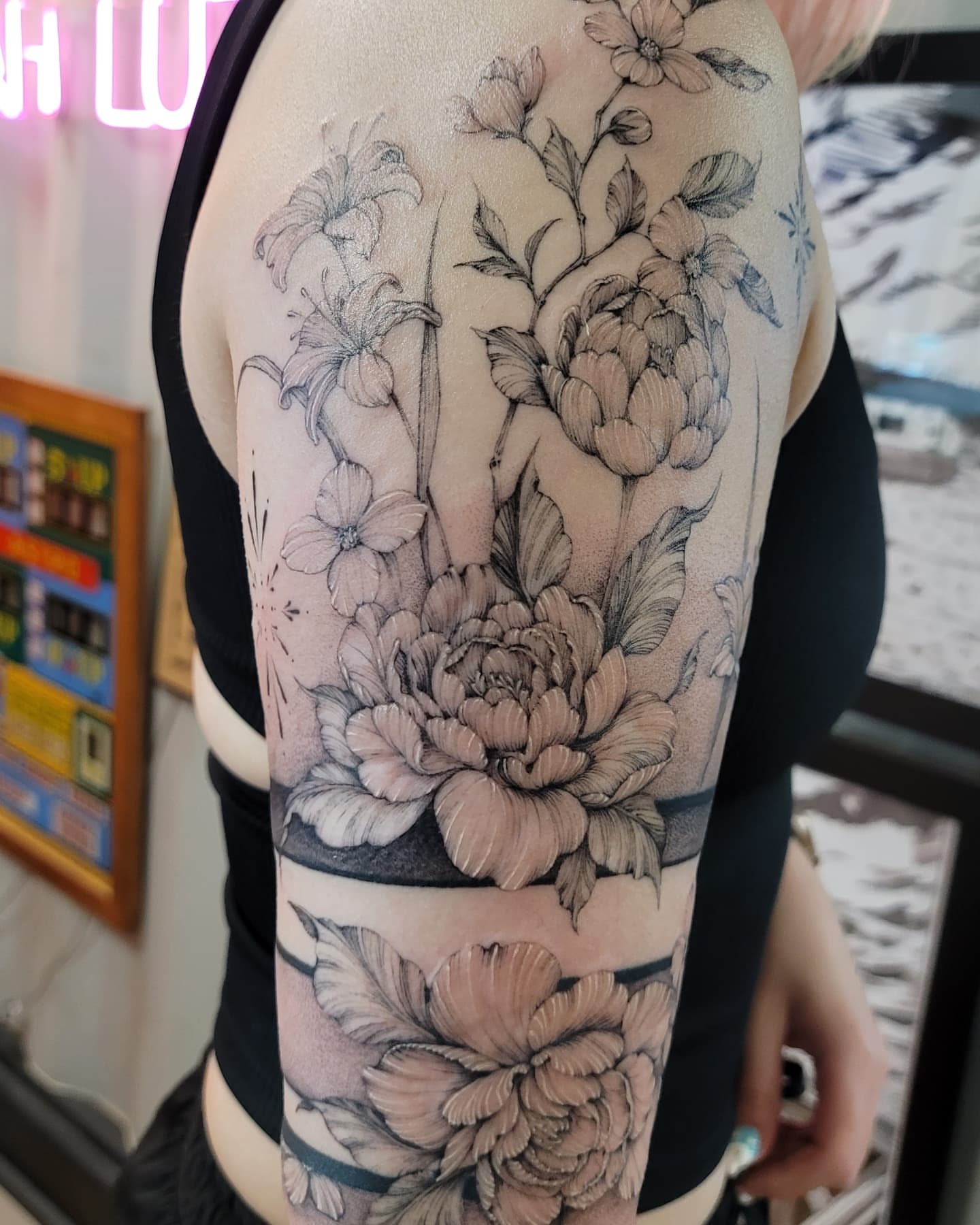 Floral arrangement black and grey tattoo on the forearm by Keith Countryman, Fort Worth, Texas