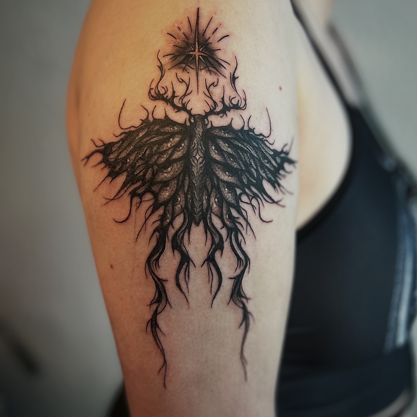 Cross with flames black and grey tattoo on the forearm by Nikki Ward