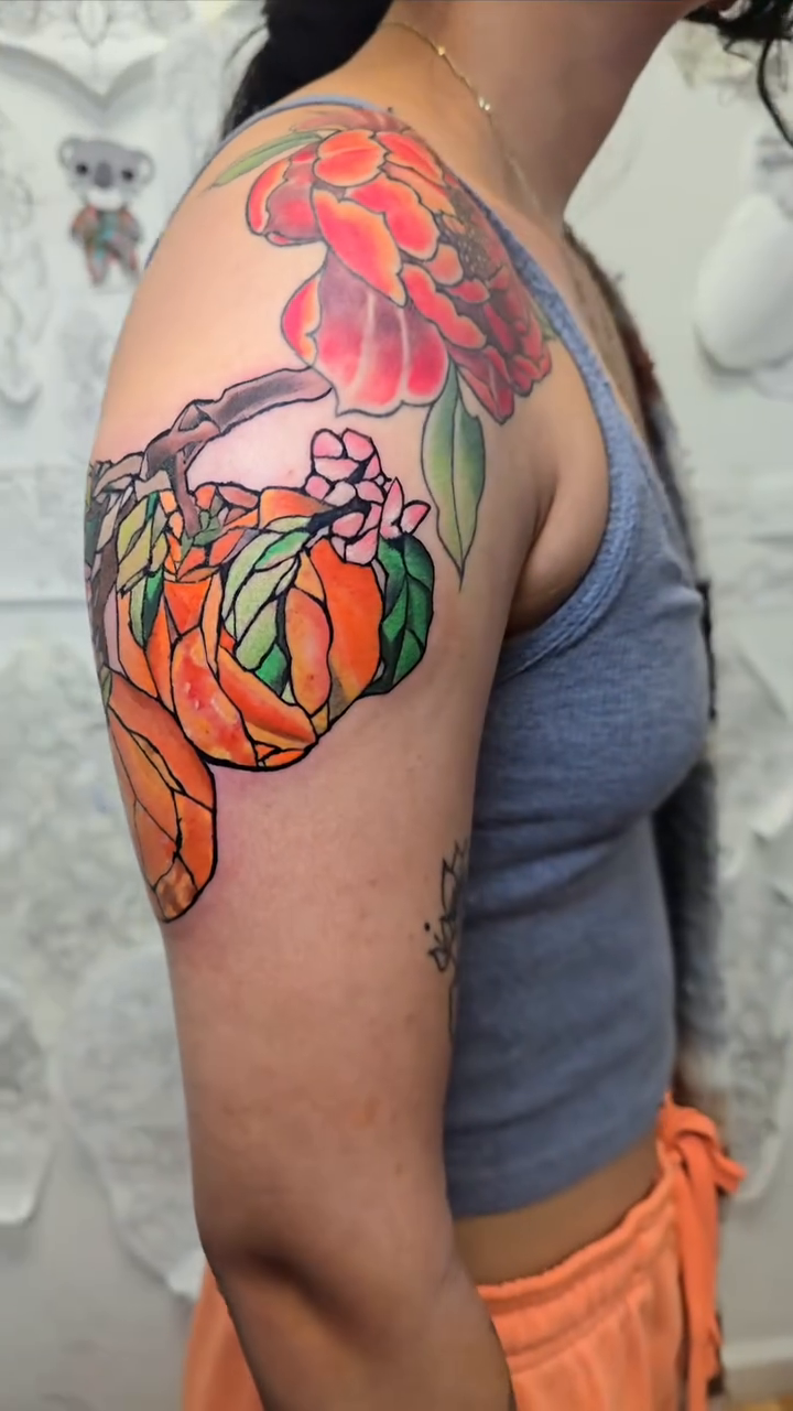 Oranges on a branch neo-traditional tattoo by Camuel Whaley