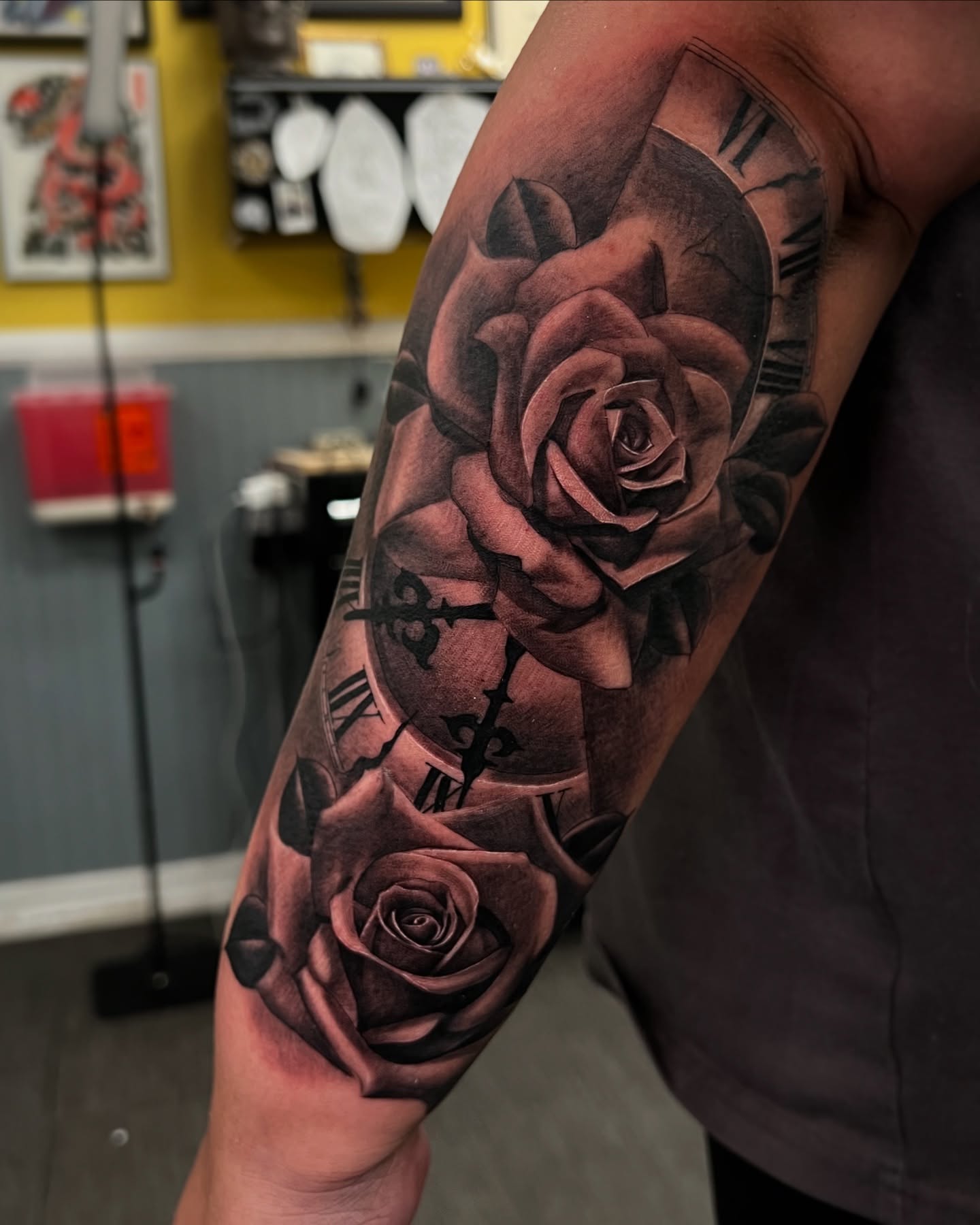 Roses and clock realism tattoo on the forearm by Vondrae