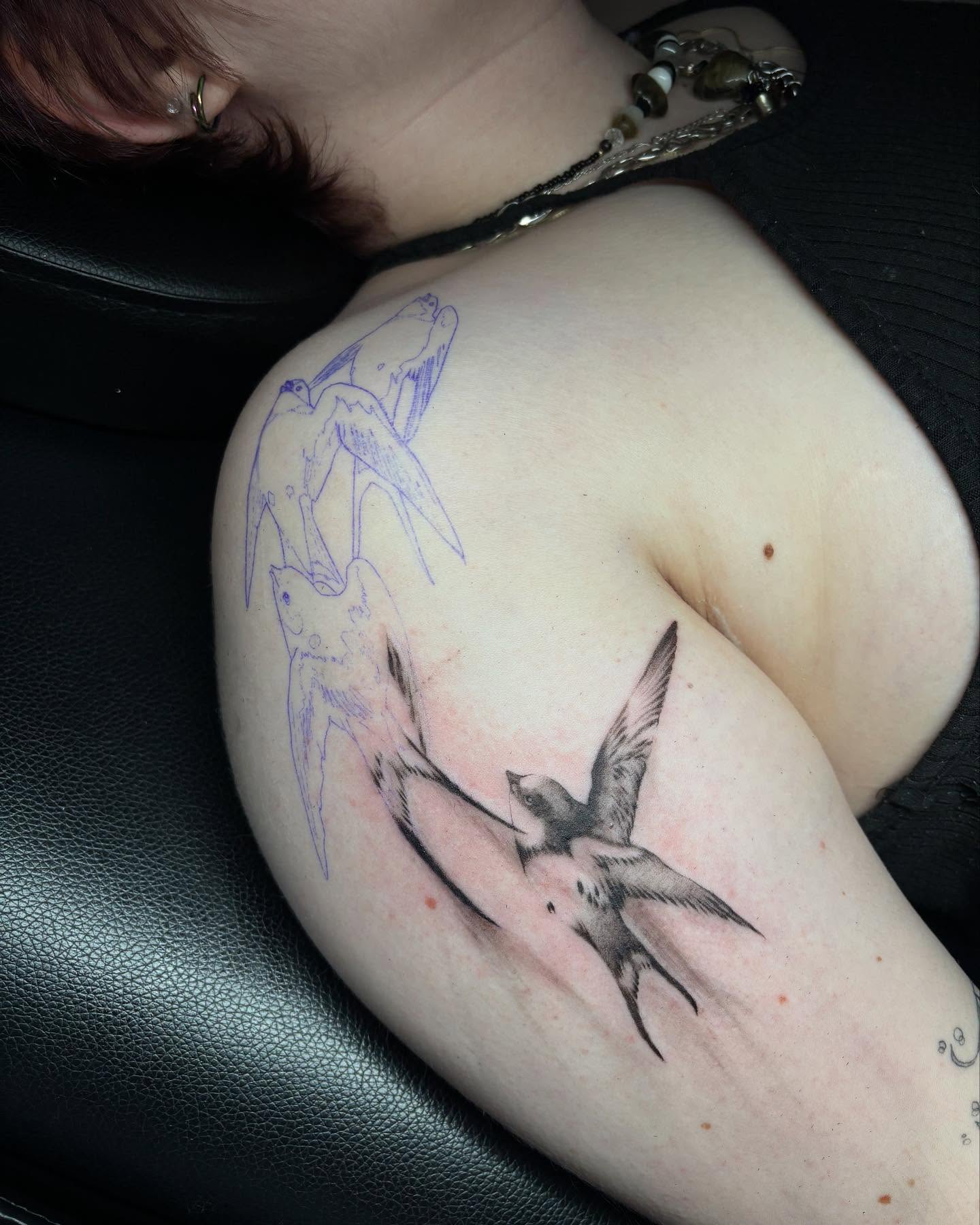 Swallows realism tattoo on the shoulder by sanjai