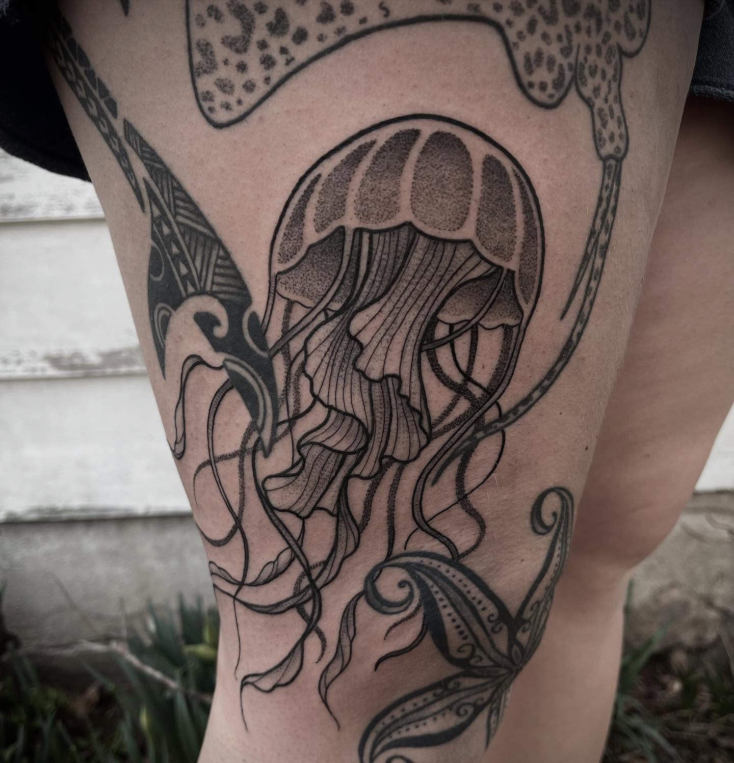Jellyfish dotwork tattoo on the thigh by Kat Ackerman