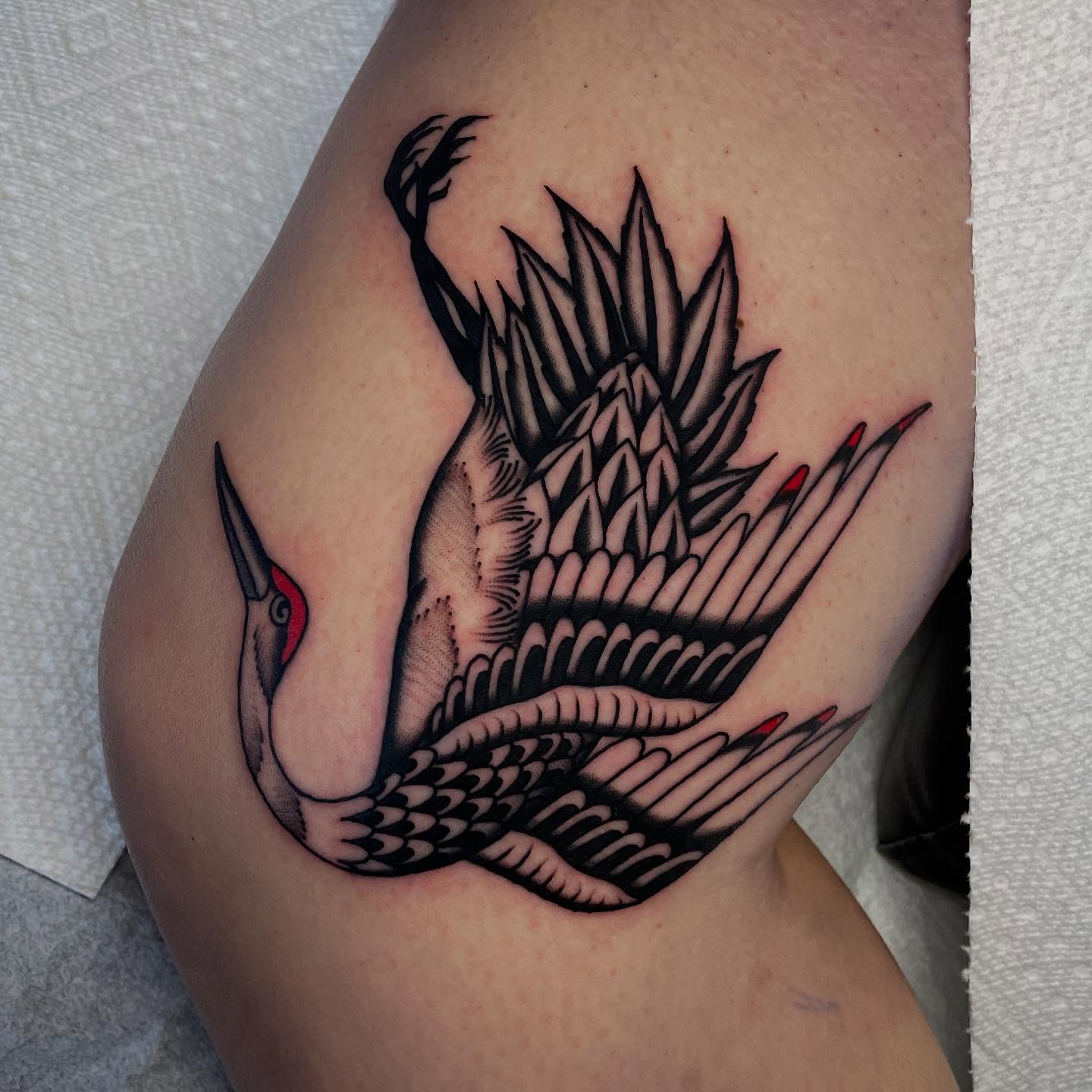 Woodpecker American traditional tattoo on the thigh by Toulouse Noble, Portland, Oregon
