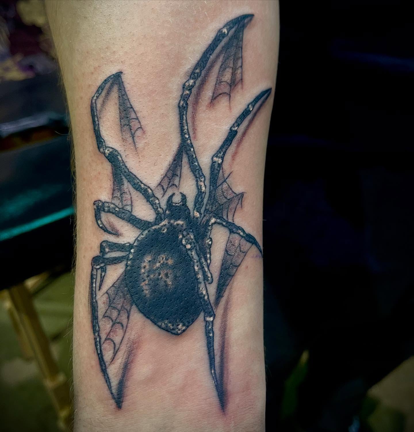Spider black and grey tattoo on the forearm by Don Juan