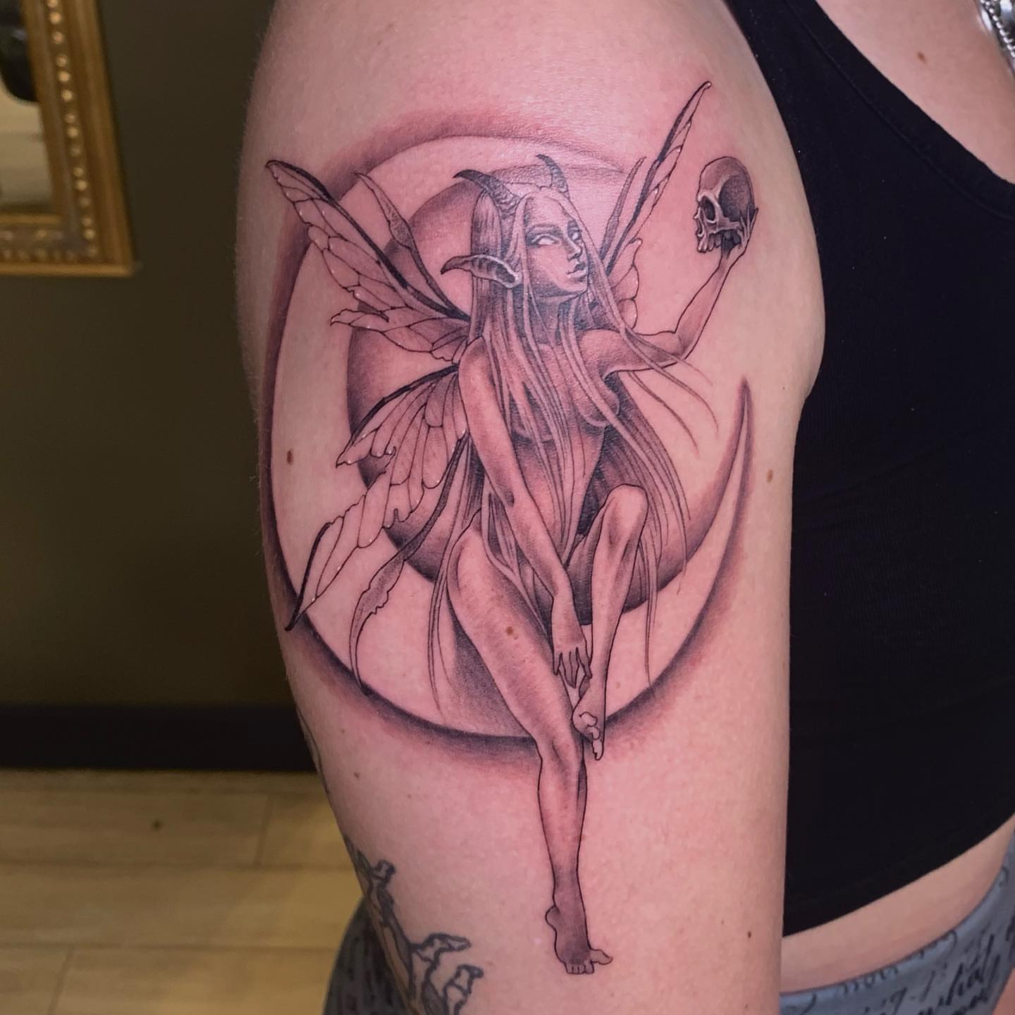 Fairy with skull realism tattoo on the thigh by Tad Fulkerson, San Francisco, California