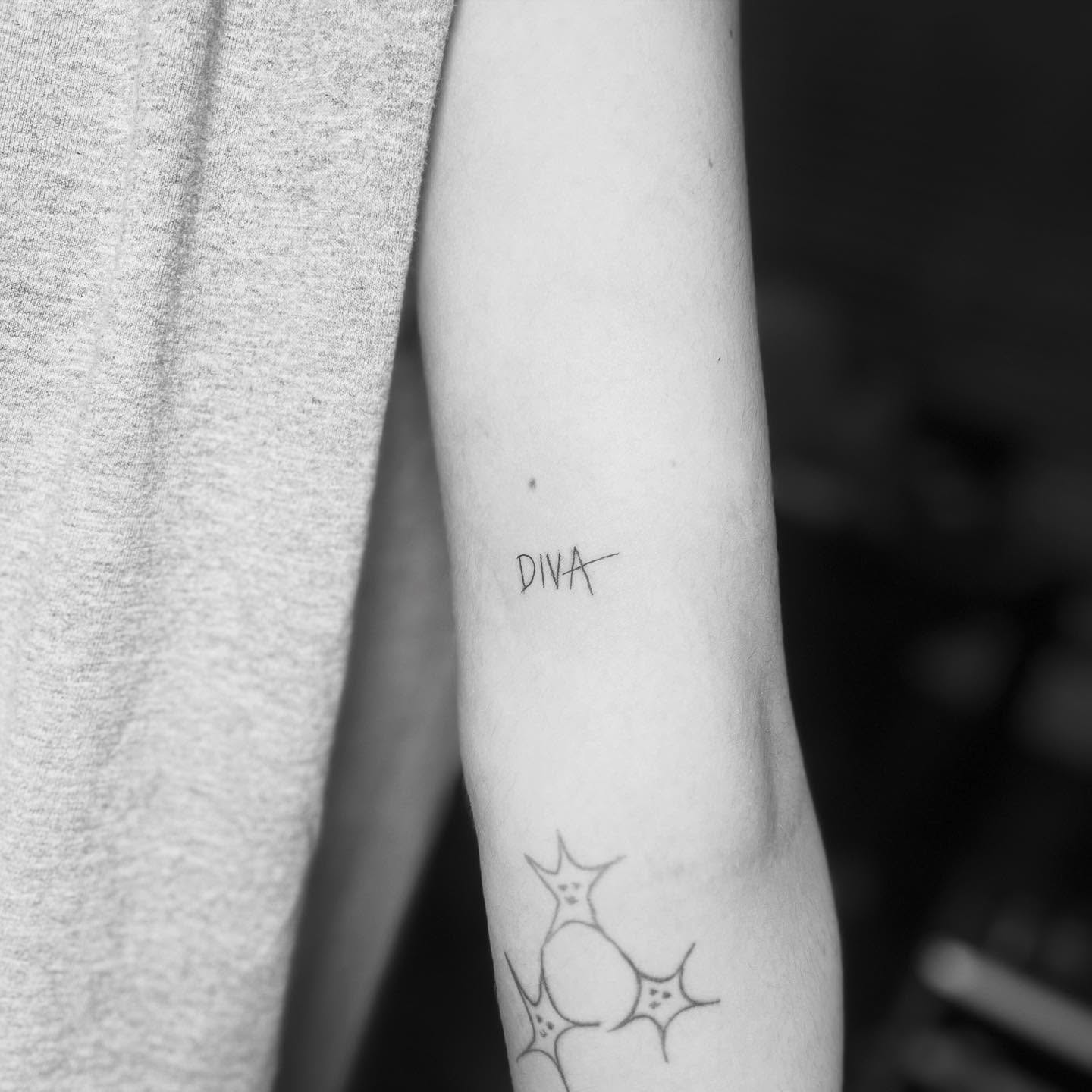 Diva fine line tattoo on the forearm by Kylee Snow