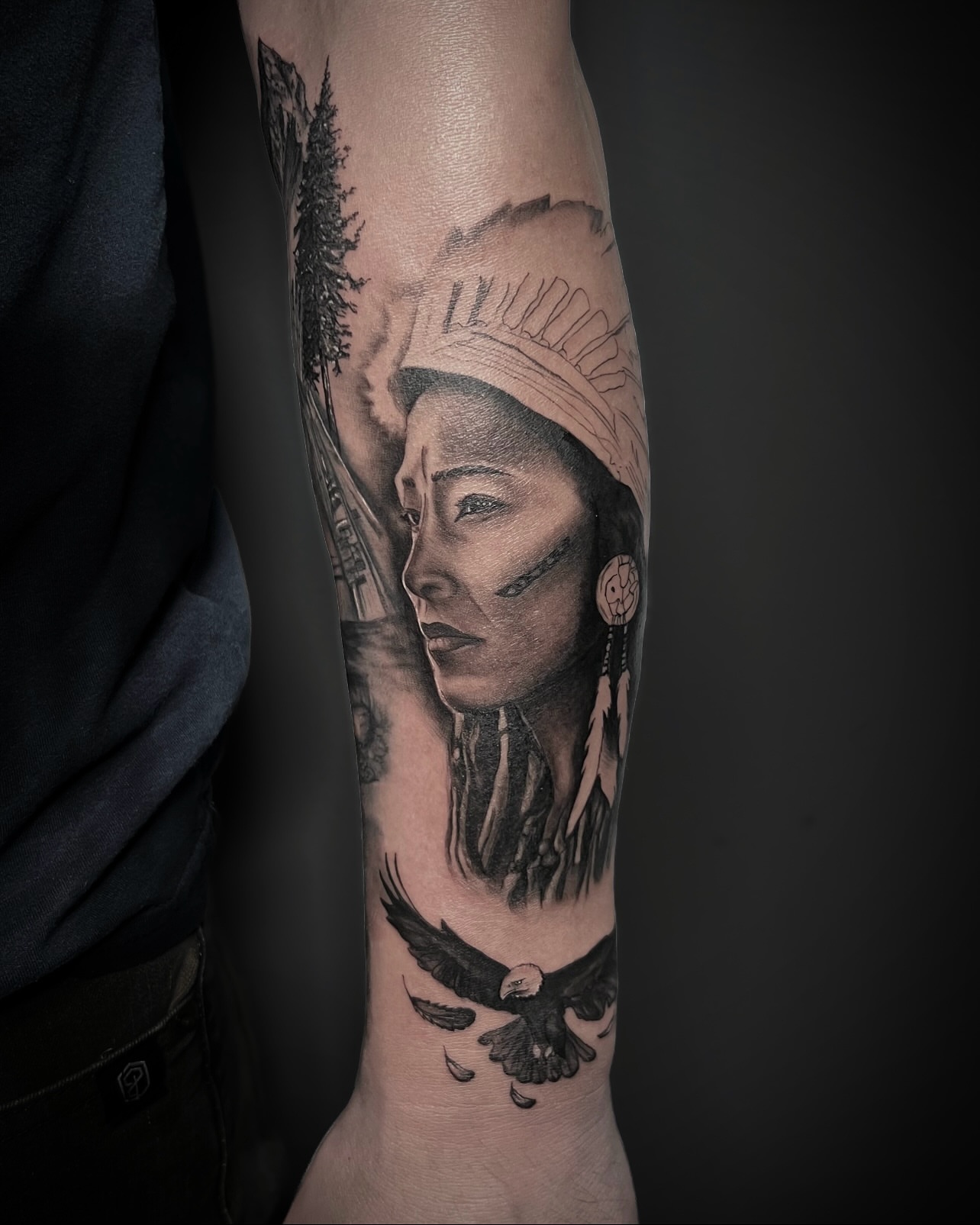 Indigenous woman with eagle realism tattoo on the forearm by Tattoos by Katherina, Willoughby, Ohio