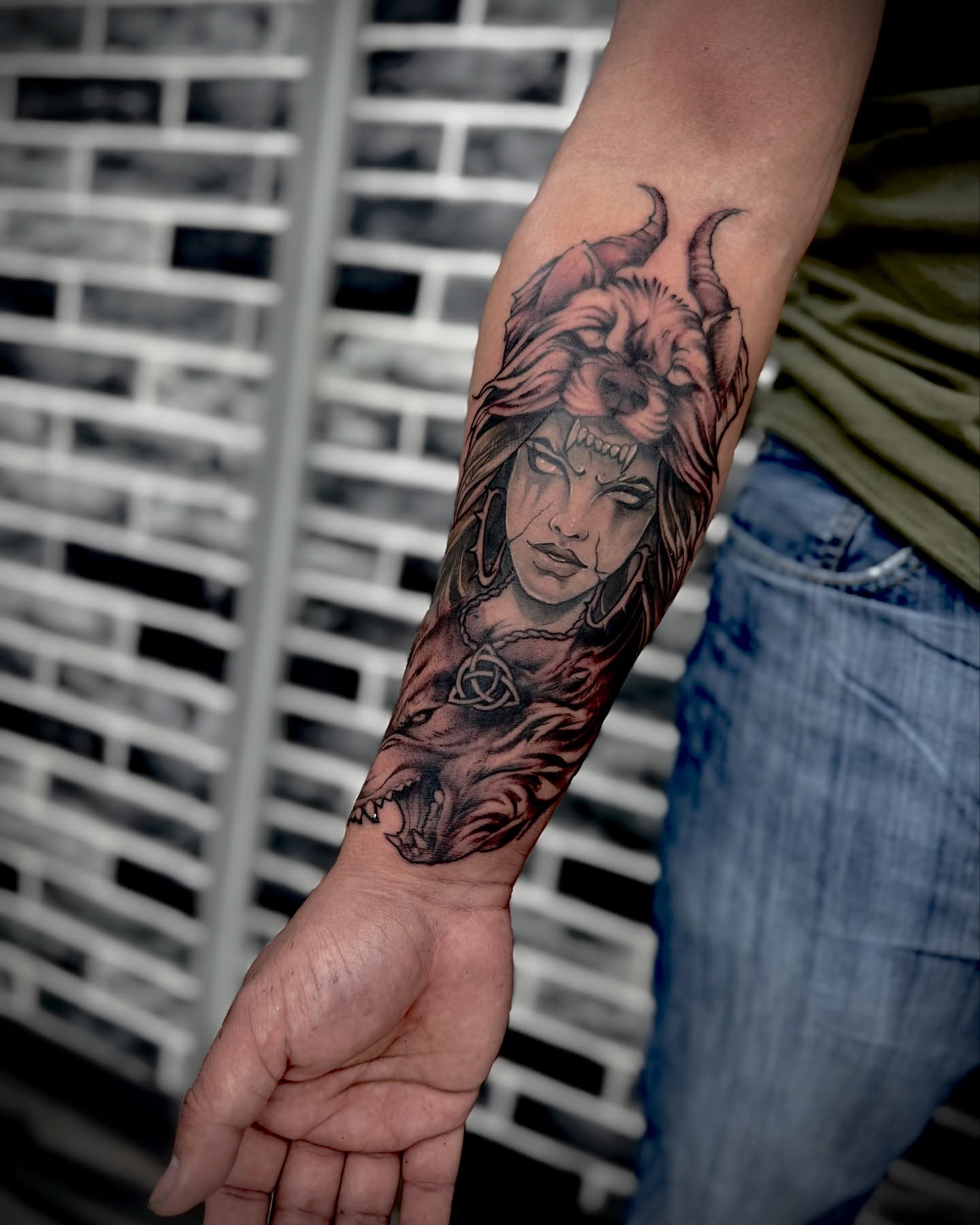 Bull-headed woman realism tattoo on the forearm by Mitsuko Ching