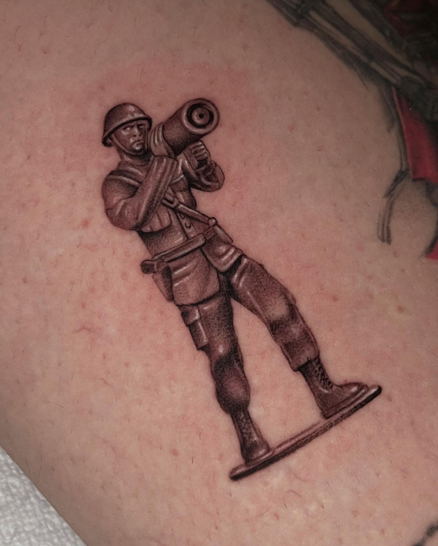 Soldier with bazooka black and grey tattoo on the forearm by Single Needle ๐ชฉ