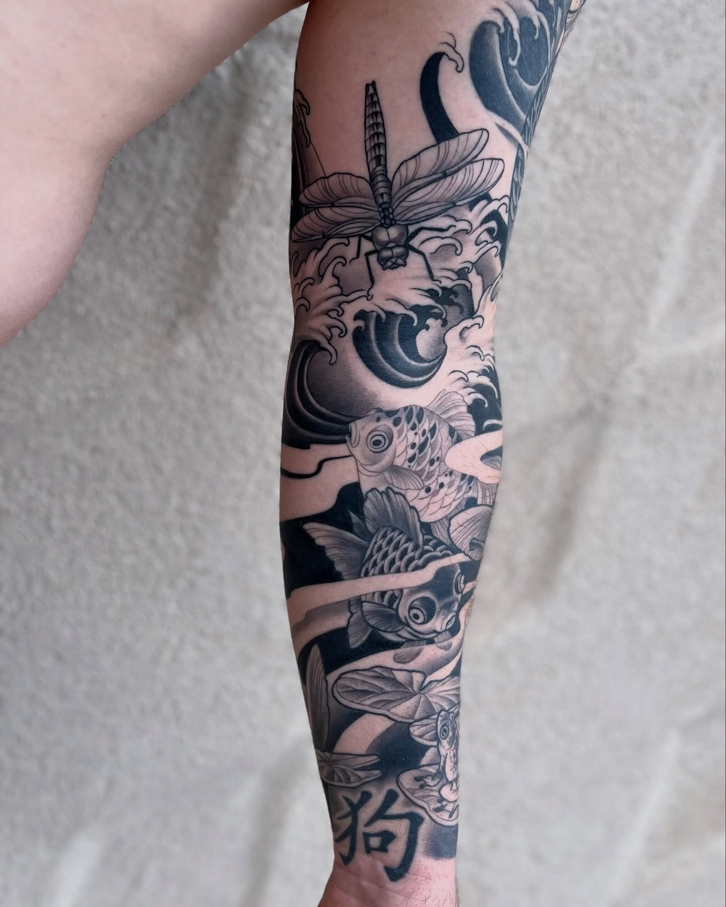 Fish and dragonfly japanese irezumi tattoo on the forearm by Angelique Sanders, Tellico Plains, Tennessee
