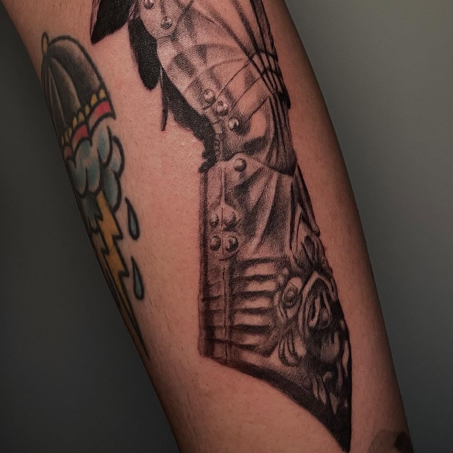 Motorcycle American traditional tattoo on the forearm by Koolz