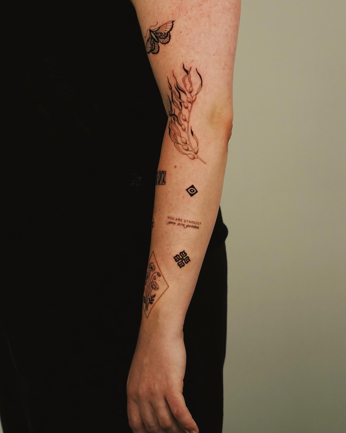 Flame and seed black and grey tattoo on the forearm by b i l l i e, Seattle, Washington