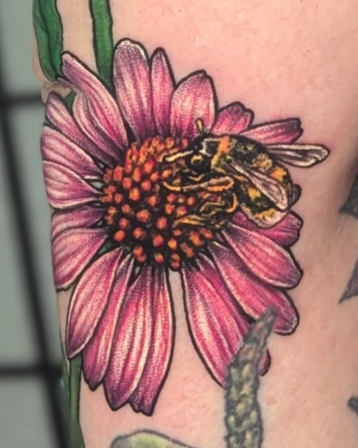 Flower and bee realism tattoo on the forearm by Jay Trip