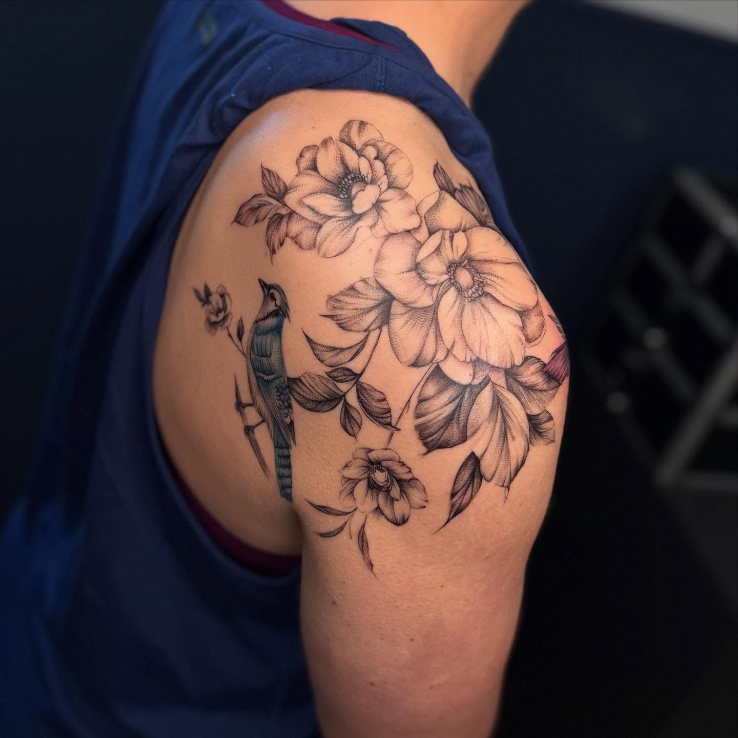 Flowers and bird black and grey tattoo on the shoulder by Jocelyn