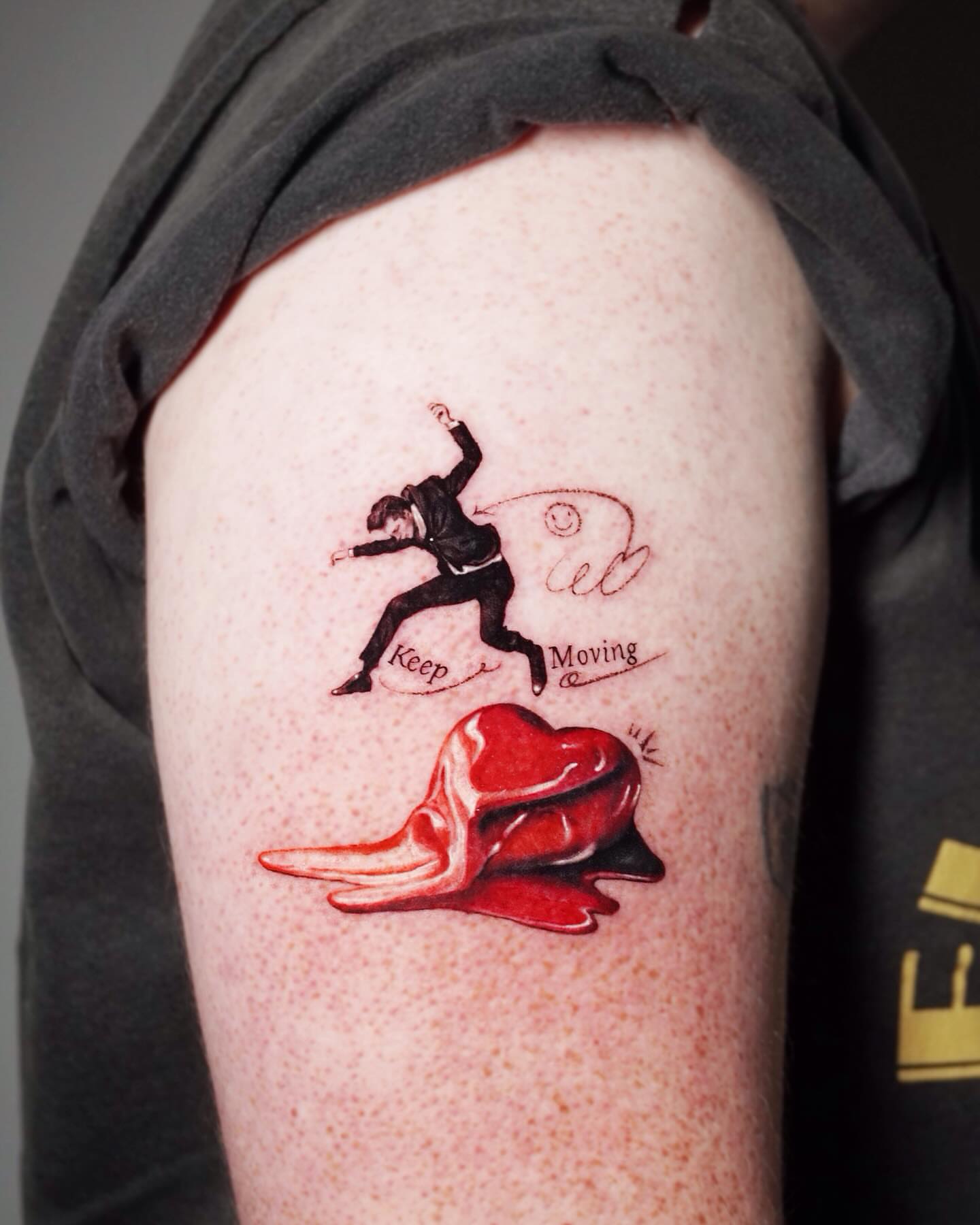 Figure jumping realism tattoo on the upper arm by Yeye
