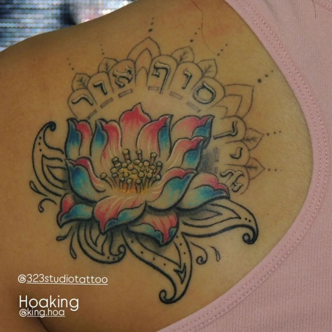 Lotus flower new school tattoo on the shoulder by Hoa King