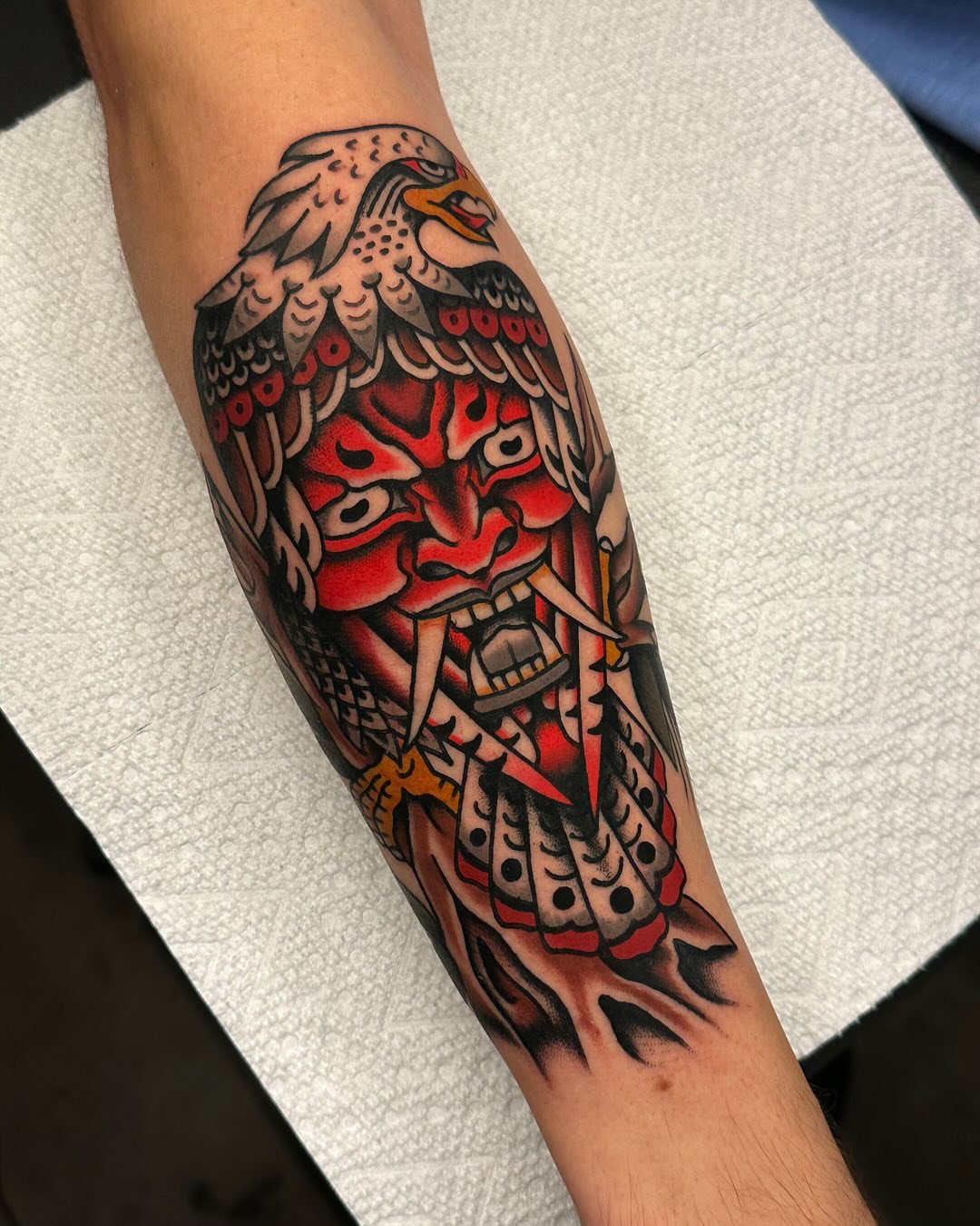Hawk and mask American traditional tattoo on the forearm by Tony Perez- Austin Texas Tattooer