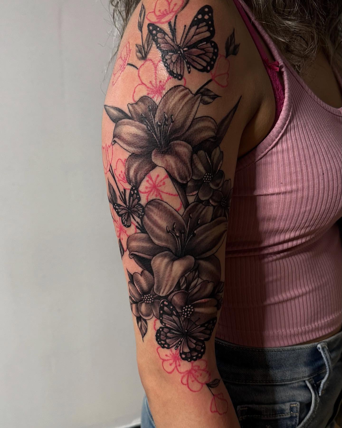 Flowers and butterflies realism tattoo on the forearm by Pablo Venegas