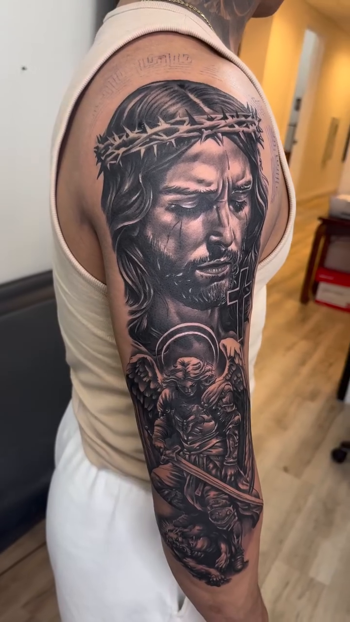 Jesus Christ and angels realism tattoo by Tattoos By Kique