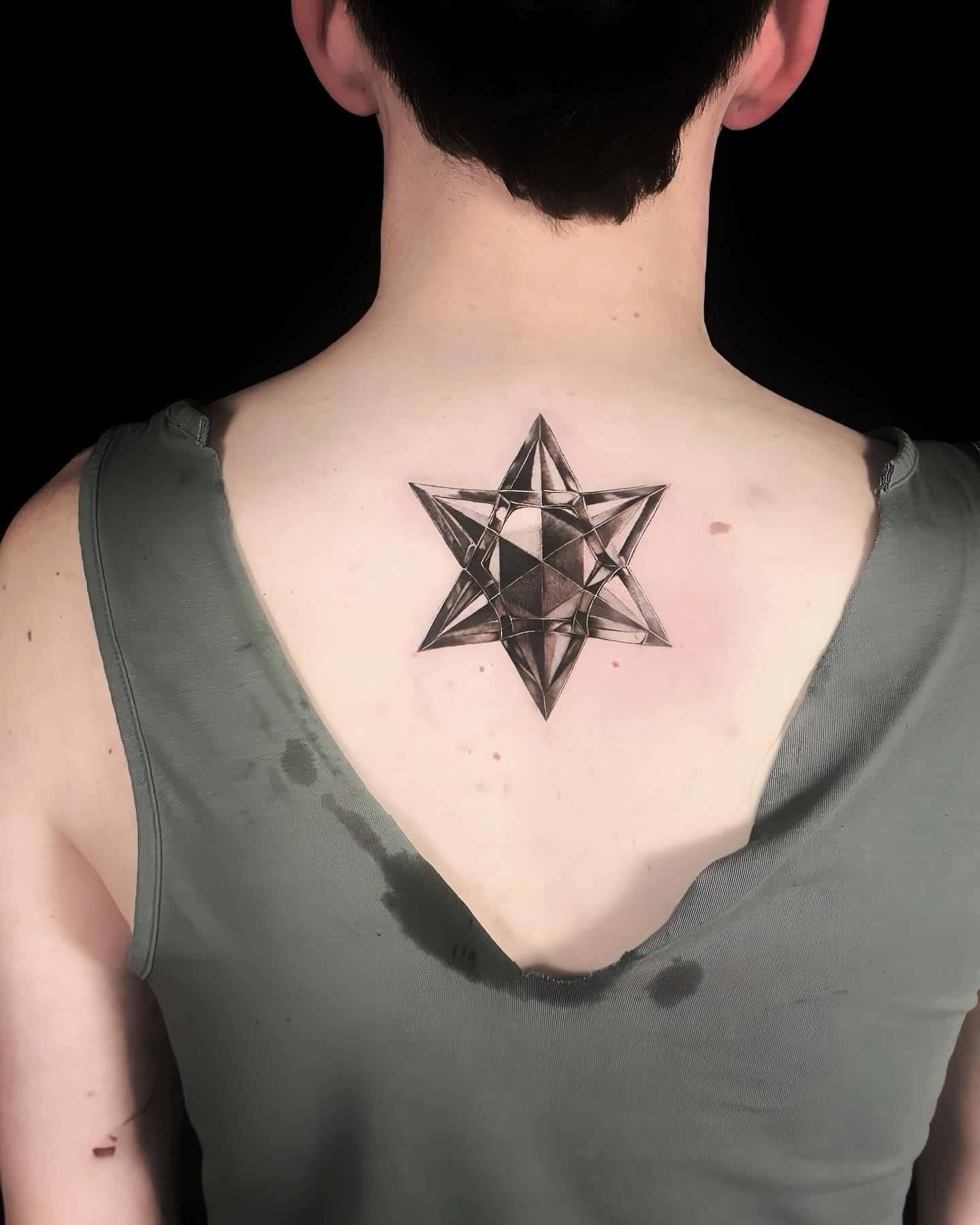 Geometric star geometric tattoo on the back by Alice Li, Houston, Texas