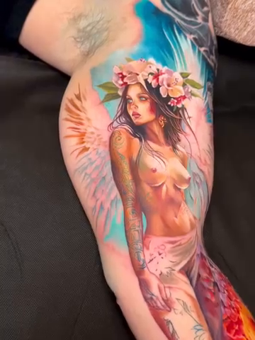 Woman with wings and mermaid tail realism tattoo by Noelin Wheeler
