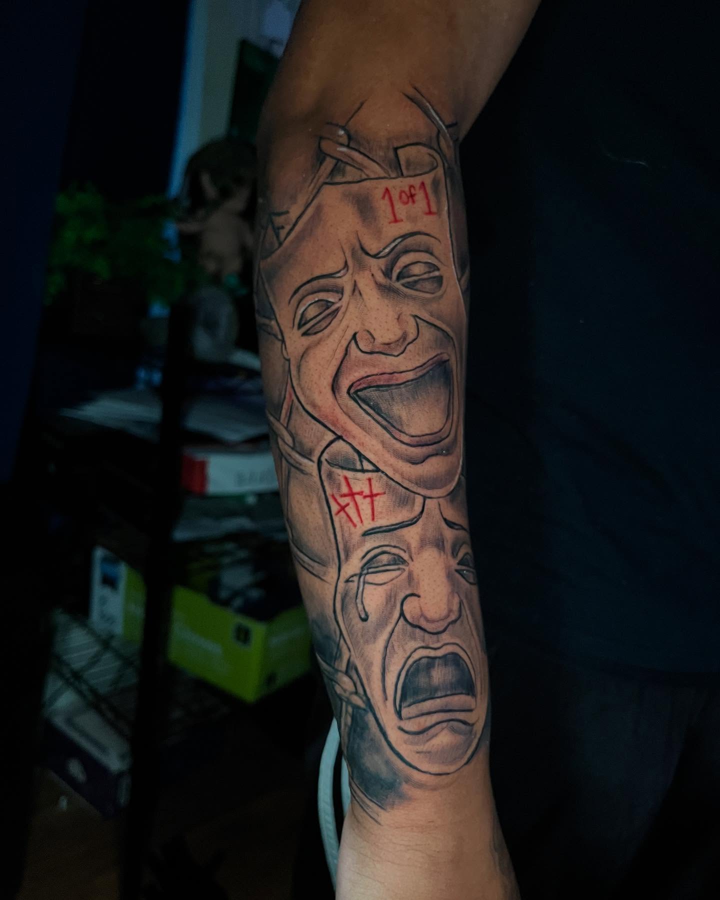Crying faces realism tattoo on the forearm by Jakobi