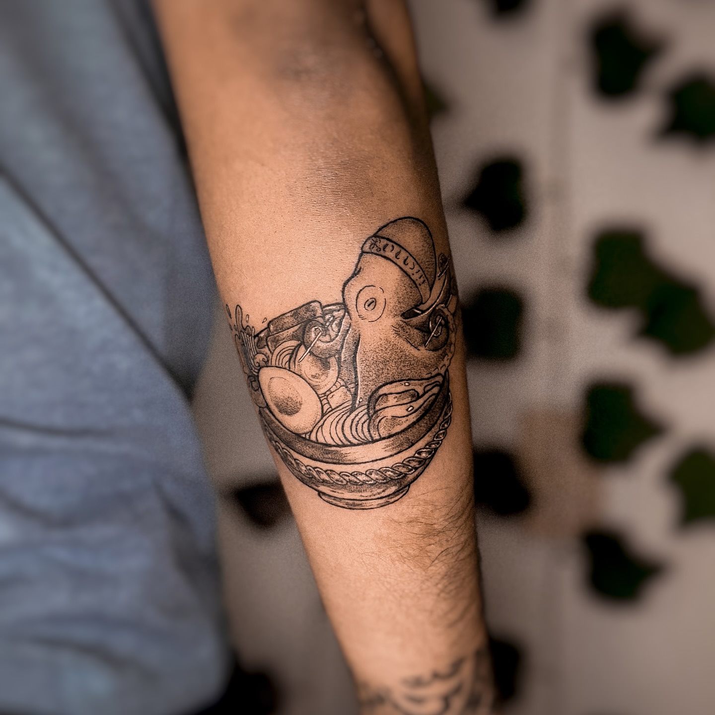 Octopus in bowl black and grey tattoo on the forearm by 조조