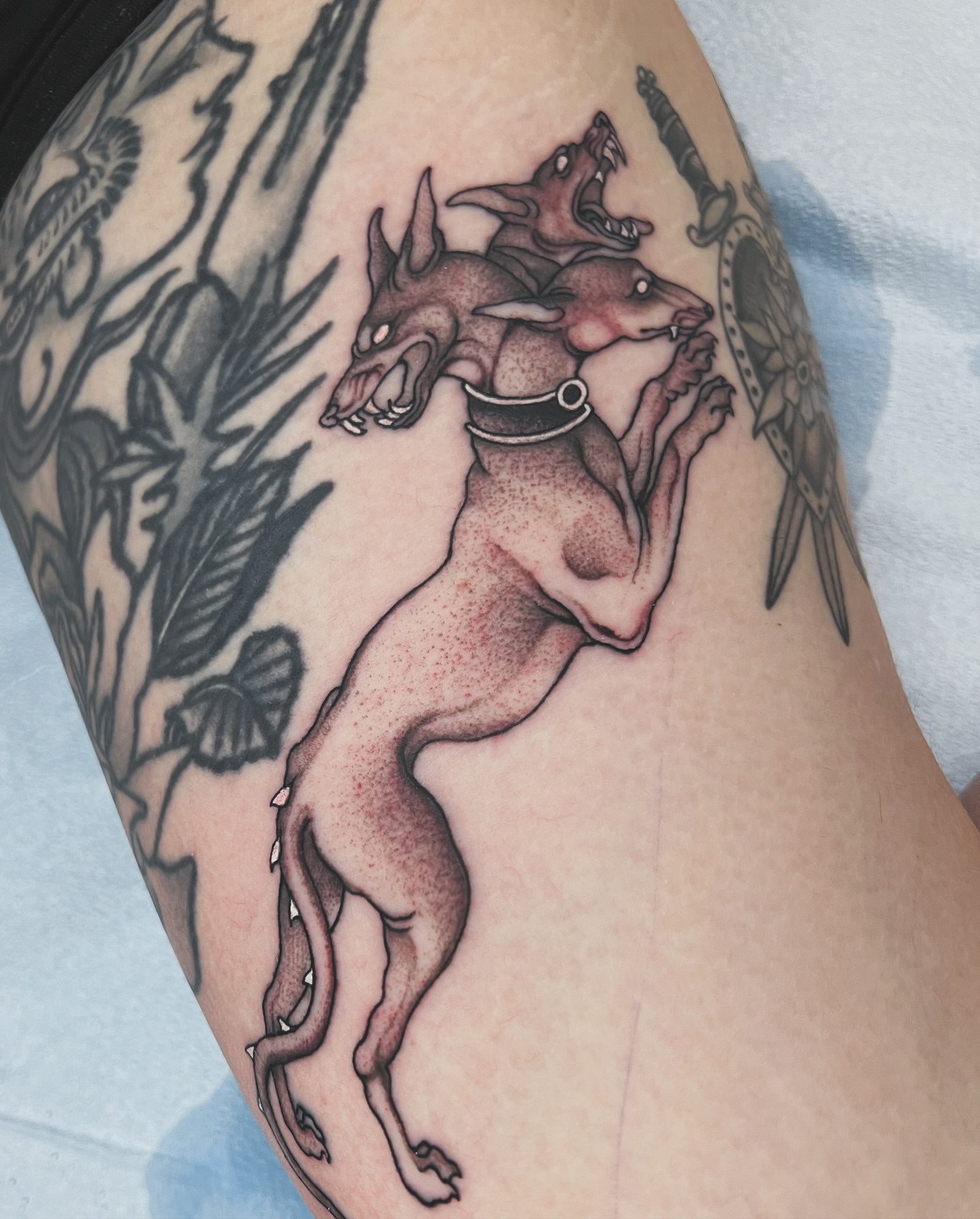 Mythical creature black and grey tattoo on the forearm by superteal