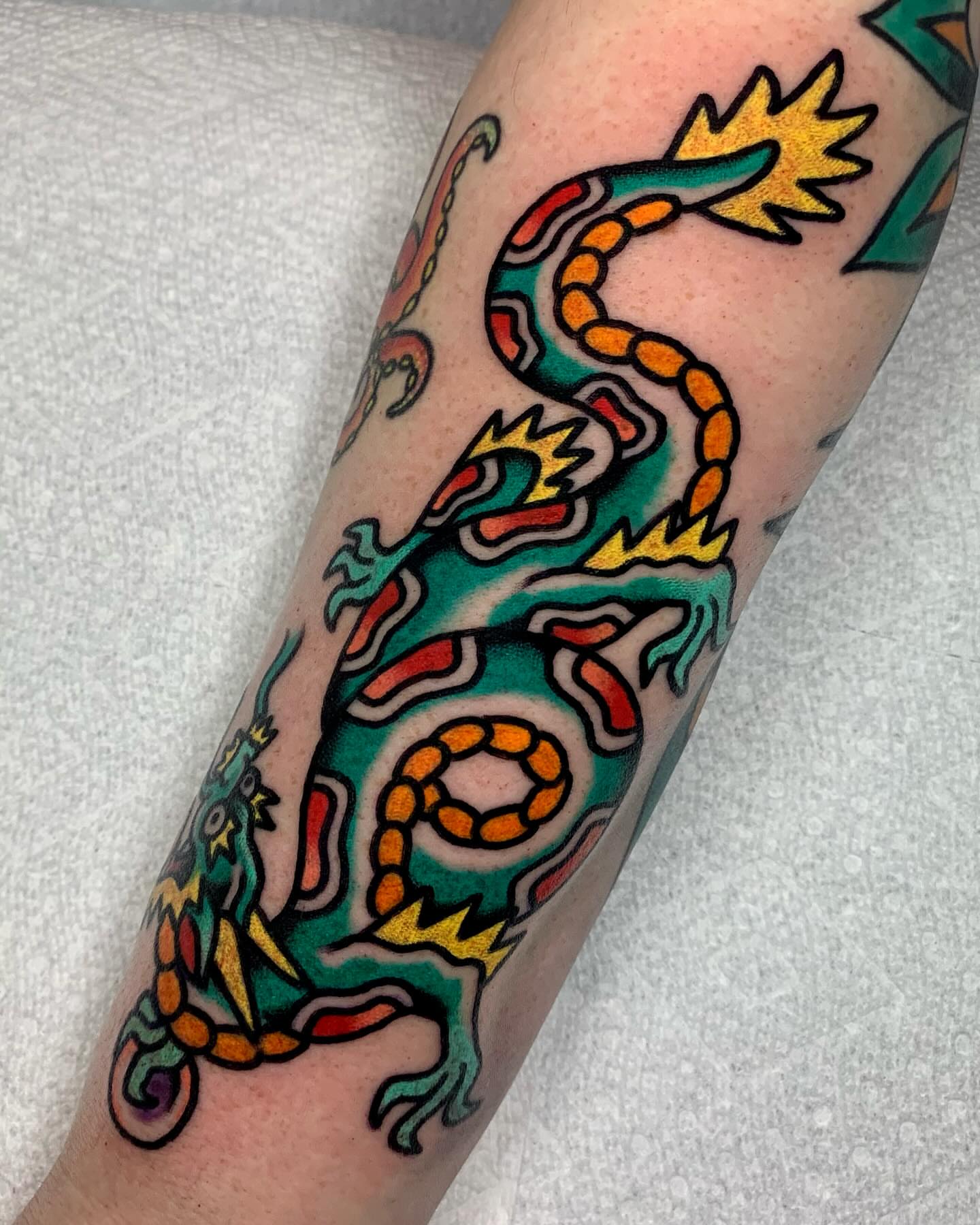 Dragon American traditional tattoo on the forearm by Shawn VanKirk