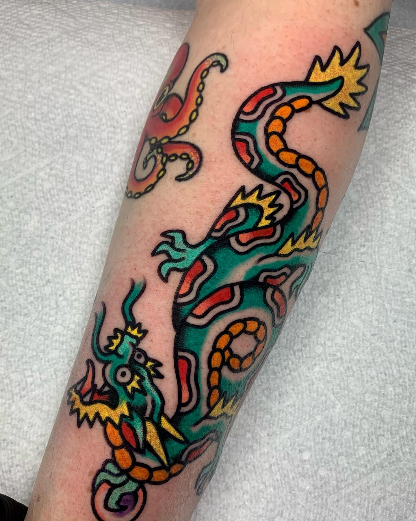 Dragon American traditional tattoo on the forearm by Shawn VanKirk