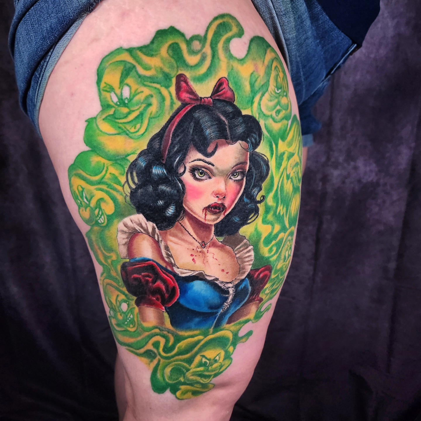 Snow White illustrative tattoo on the thigh by Chris Bowen