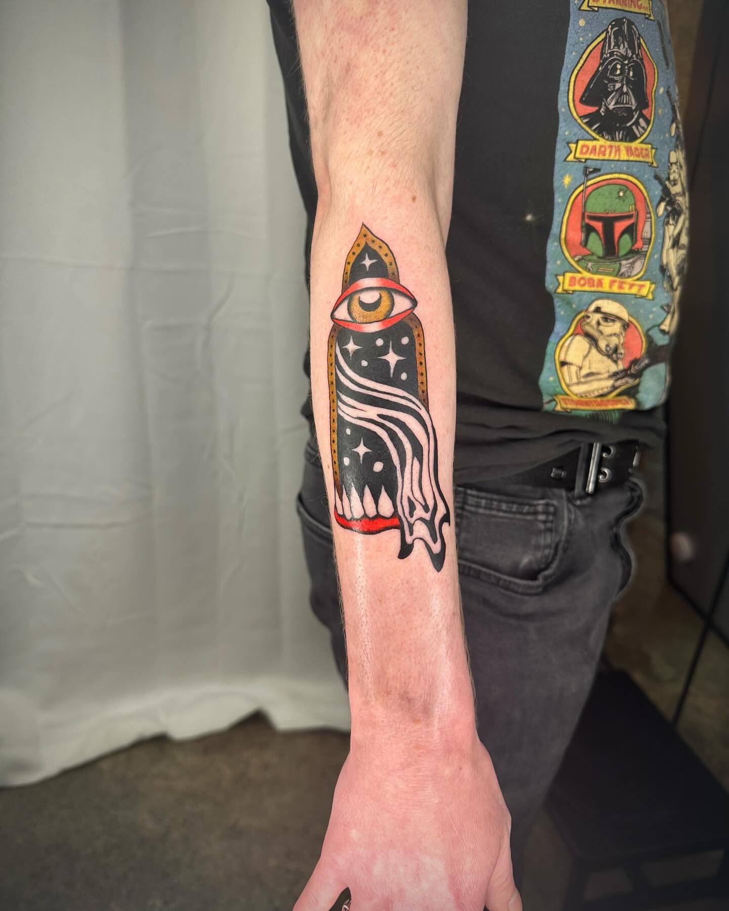 Eye and flame American traditional tattoo on the forearm by rory
