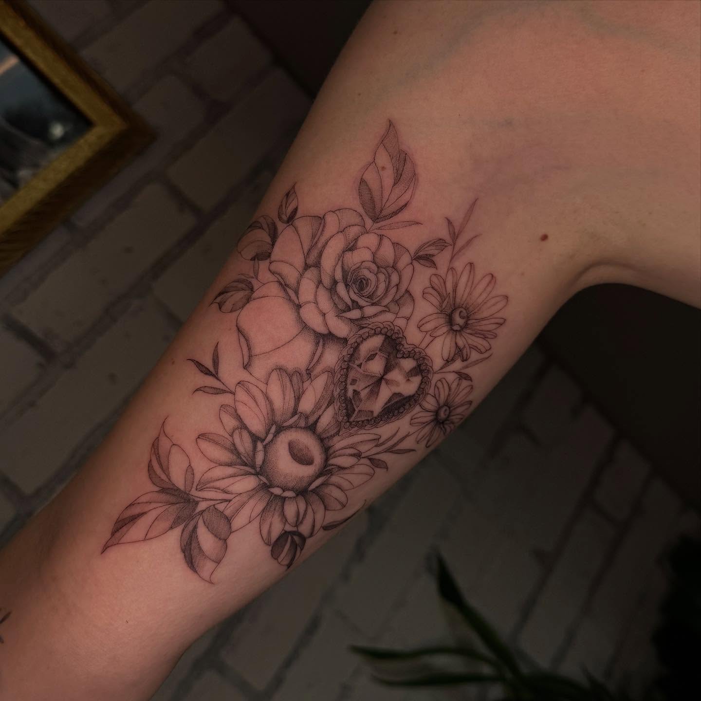 Floral bouquet with heart realism tattoo on the forearm by ❀ Moo, Mount Laurel, New Jersey