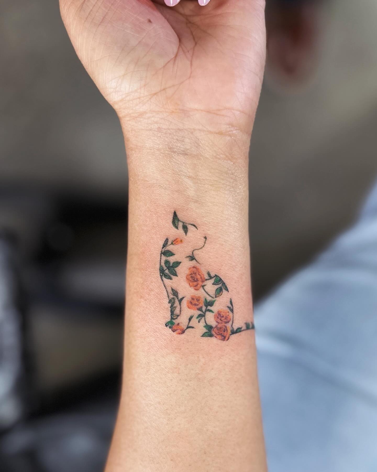 Cat with flowers fine line tattoo on the forearm by Shawn Feng