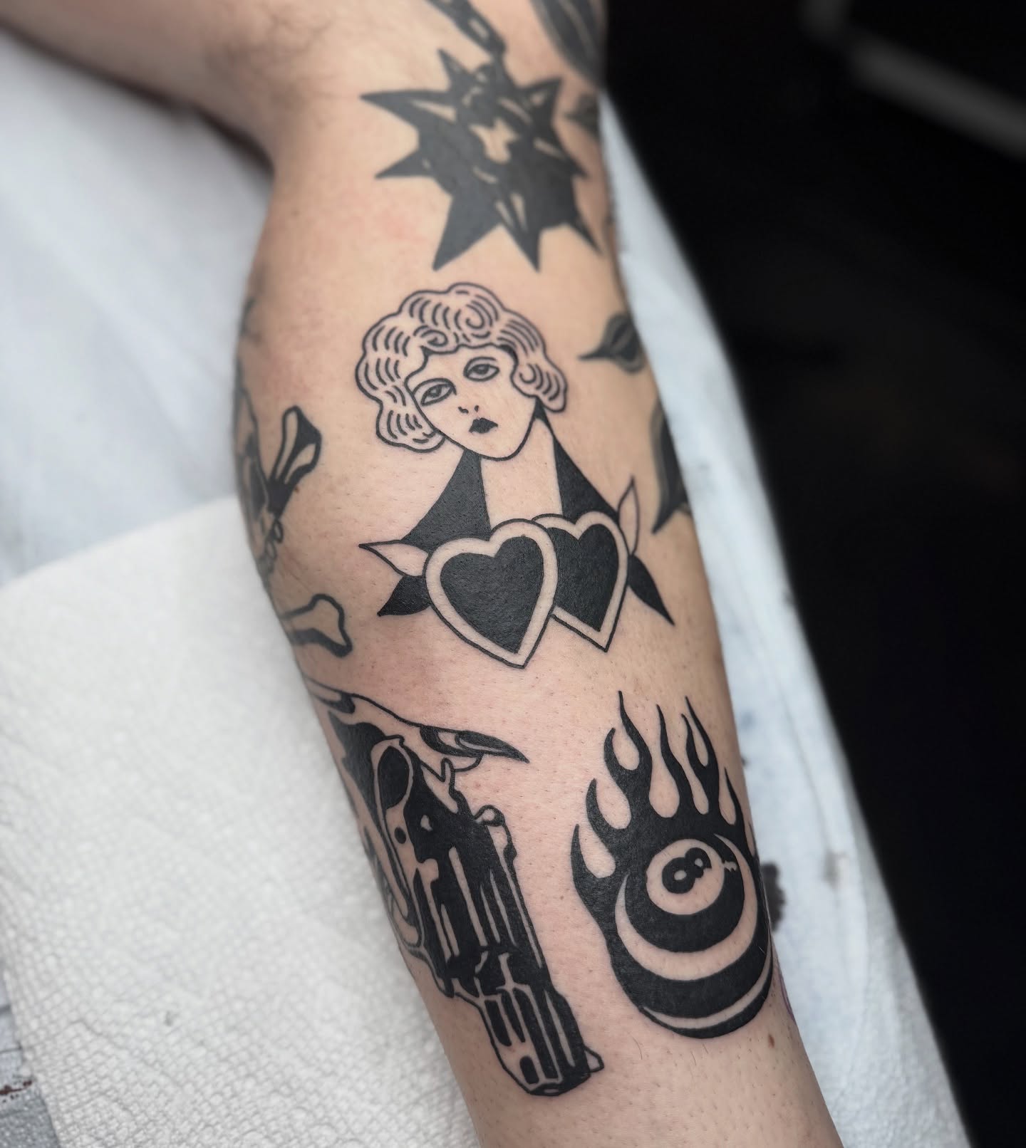 Woman with hearts black and grey tattoo on the forearm by Han shinko, Portland, Oregon