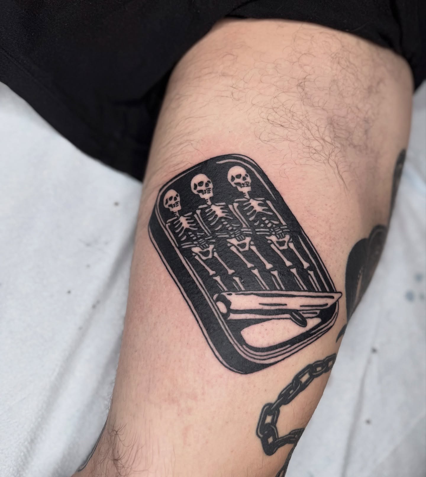 Skeletons in coffin black and grey tattoo on the forearm by Han shinko, Portland, Oregon