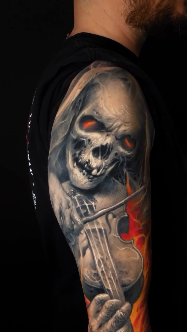 Grim reaper playing violin with flames realism tattoo by David Jorquera