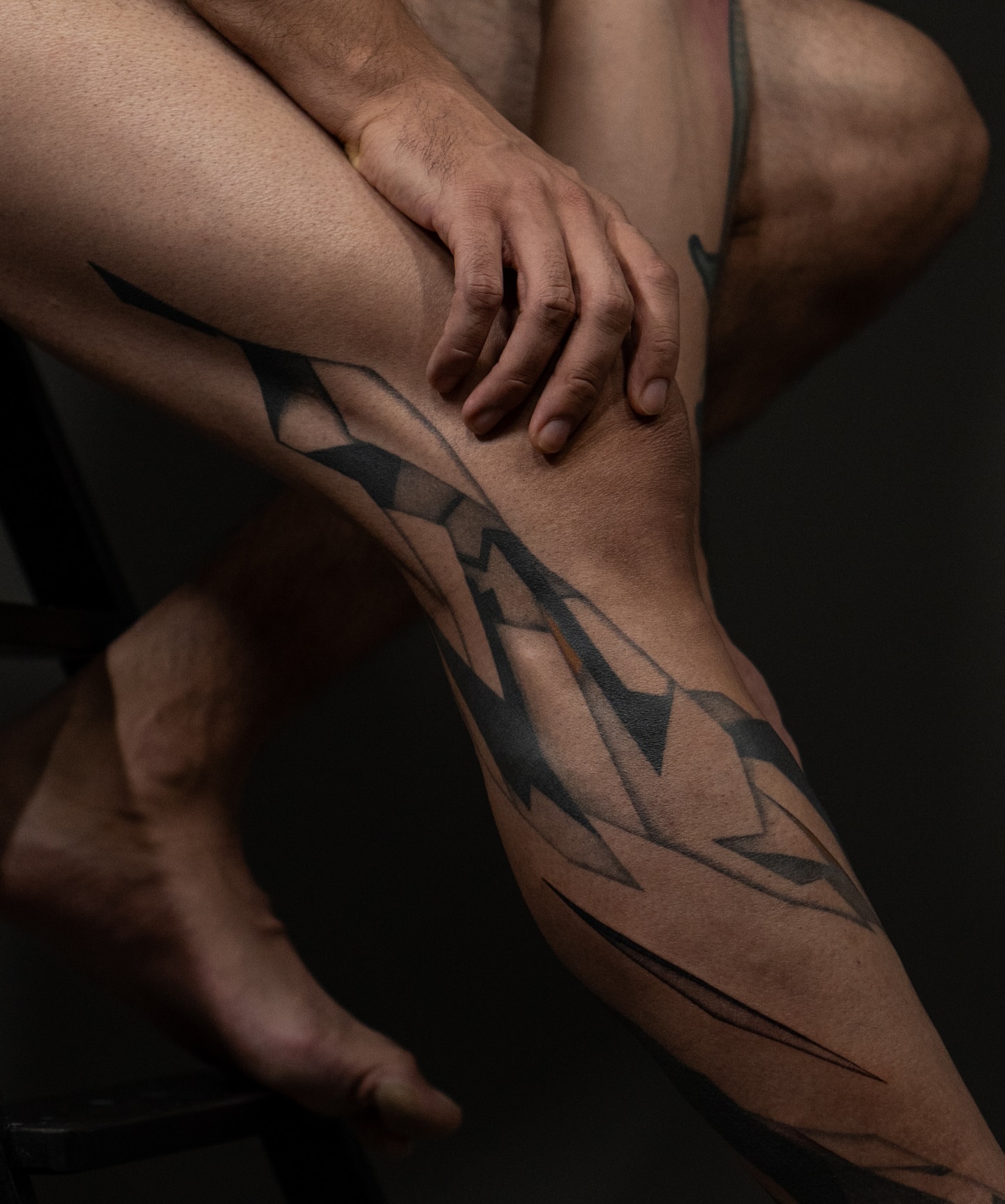Geometric pattern geometric tattoo on the calf by Pietro Moleti