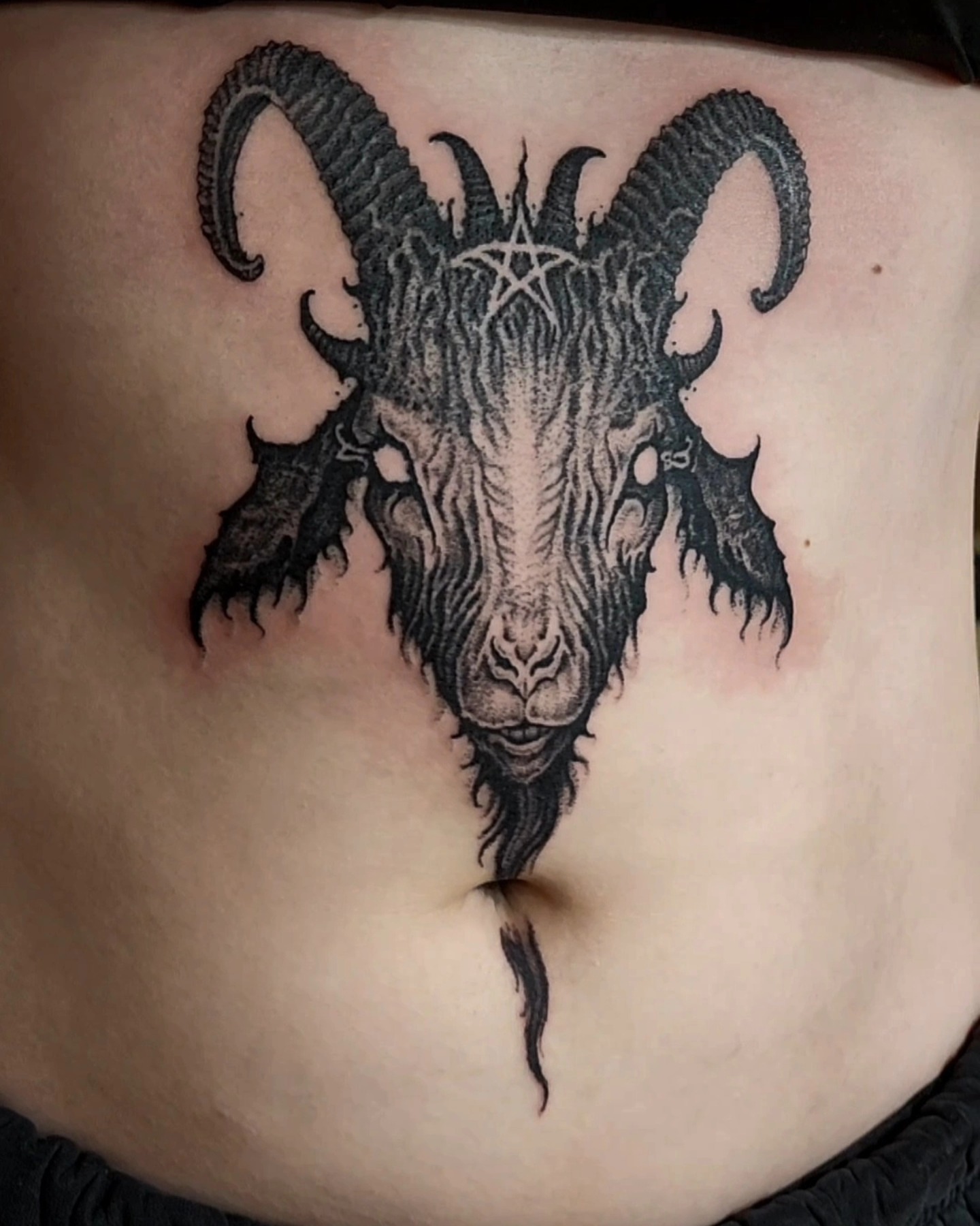 Goat head realism tattoo on the ribs by @hellscribe