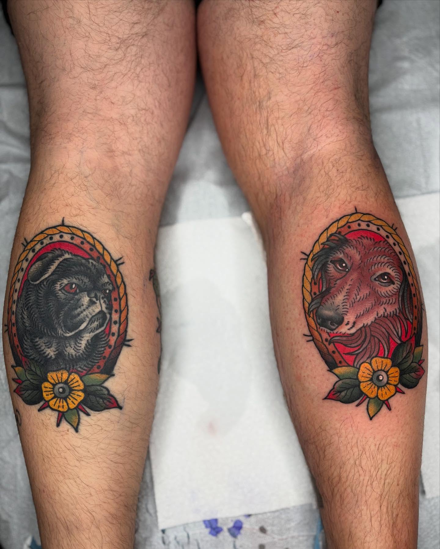 Dogs American traditional tattoo on the leg by Cody Collins