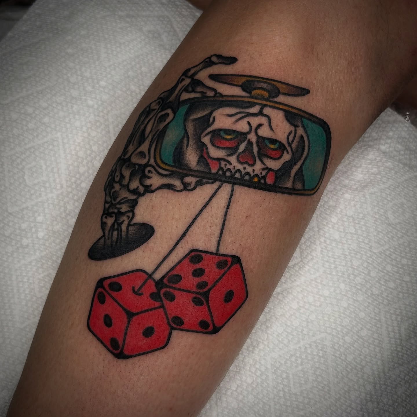 Dice and skull American traditional tattoo on the forearm by Bright-bold-classic Tattoos, North Hills