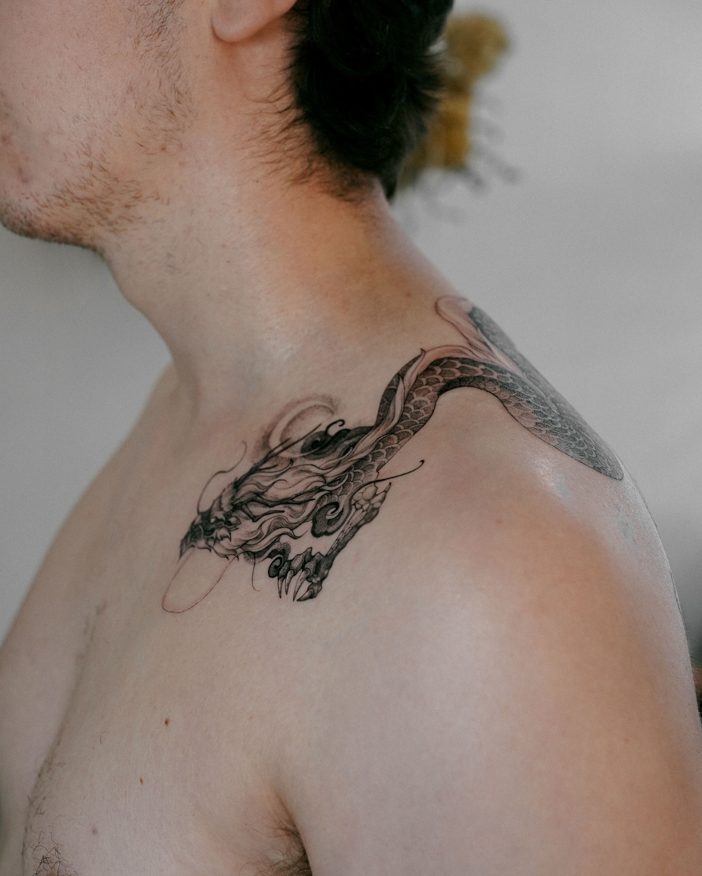 Dragon black and grey tattoo on the shoulder by Yeonji