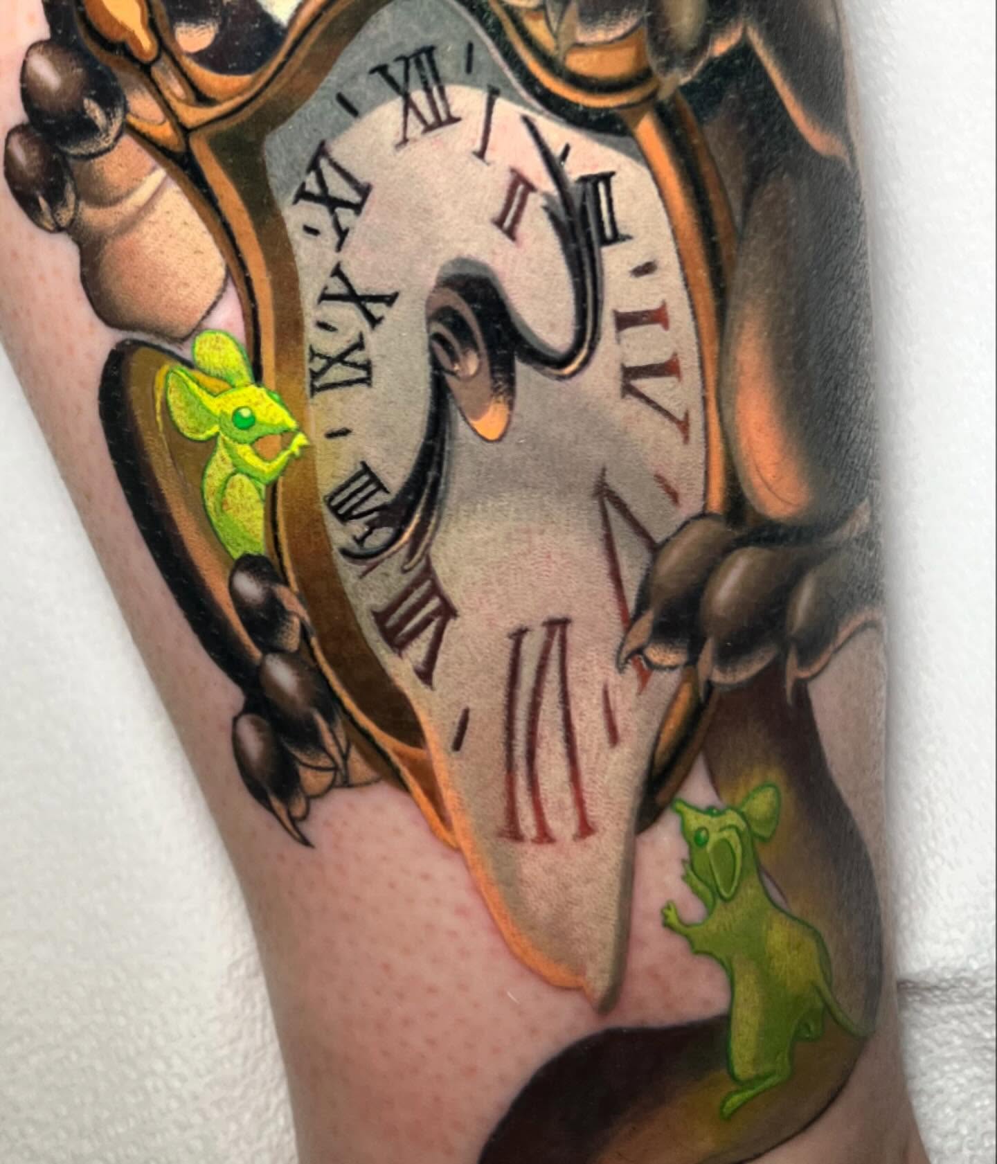 Clock and mice realism tattoo on the forearm by Tim Stafford