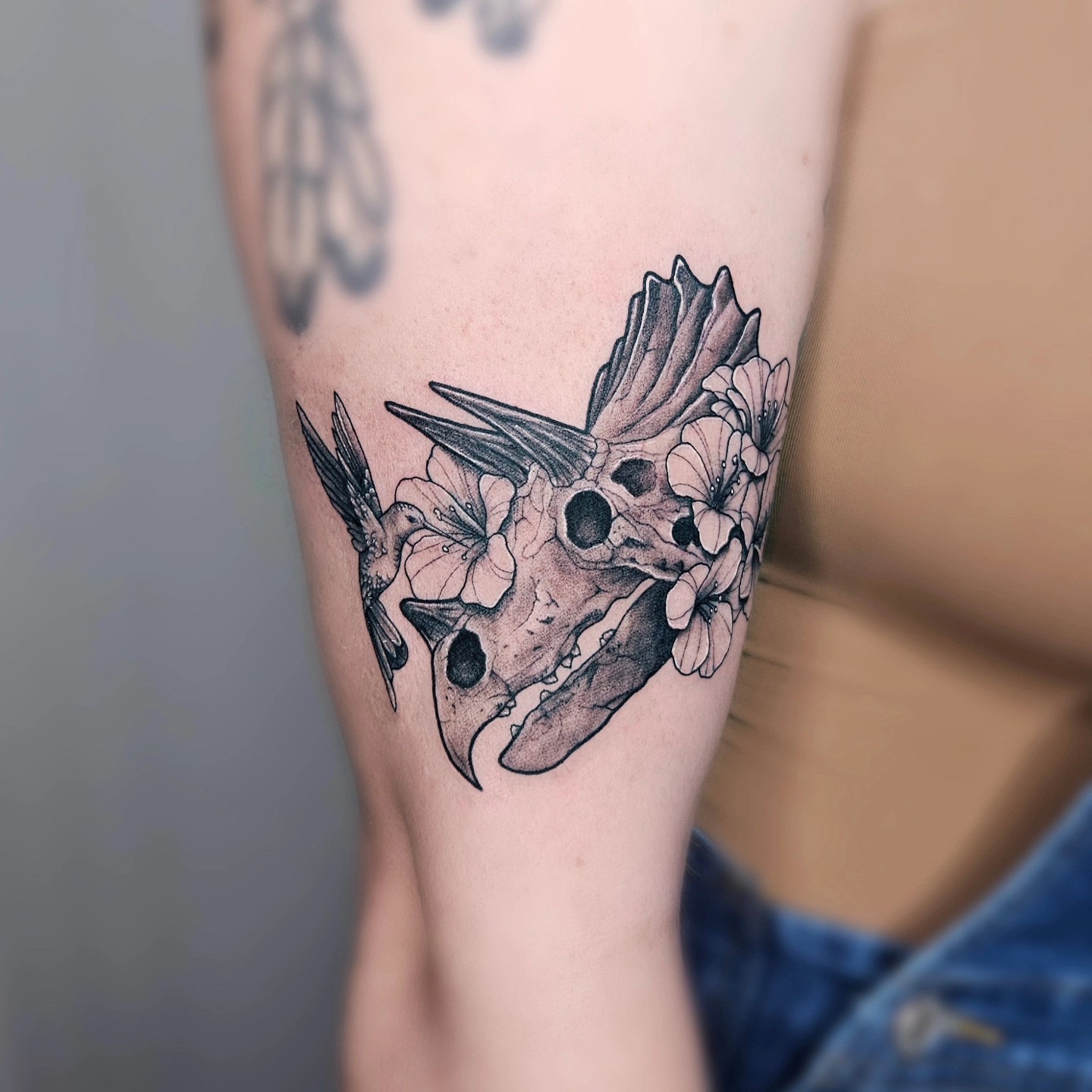 Skull with flowers black and grey tattoo on the forearm by TaylorLeighShermanTattoos OFFICIAL