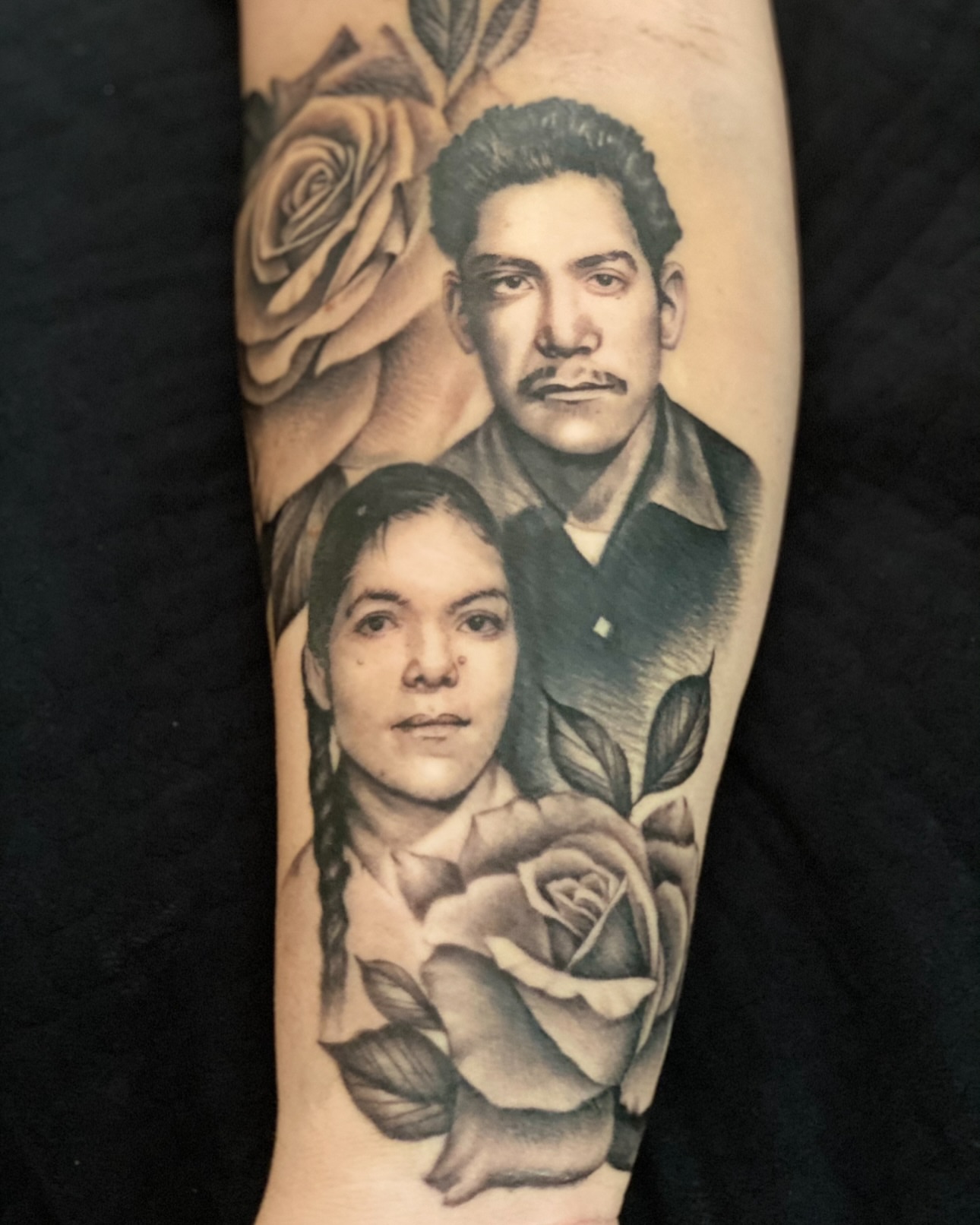 Portrait realism tattoo on the forearm by Julio Ferrer