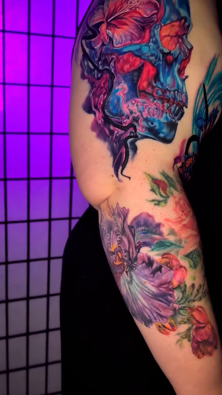 Skull with flowers neo-traditional tattoo by Colorful Tattoos by Cody Dean