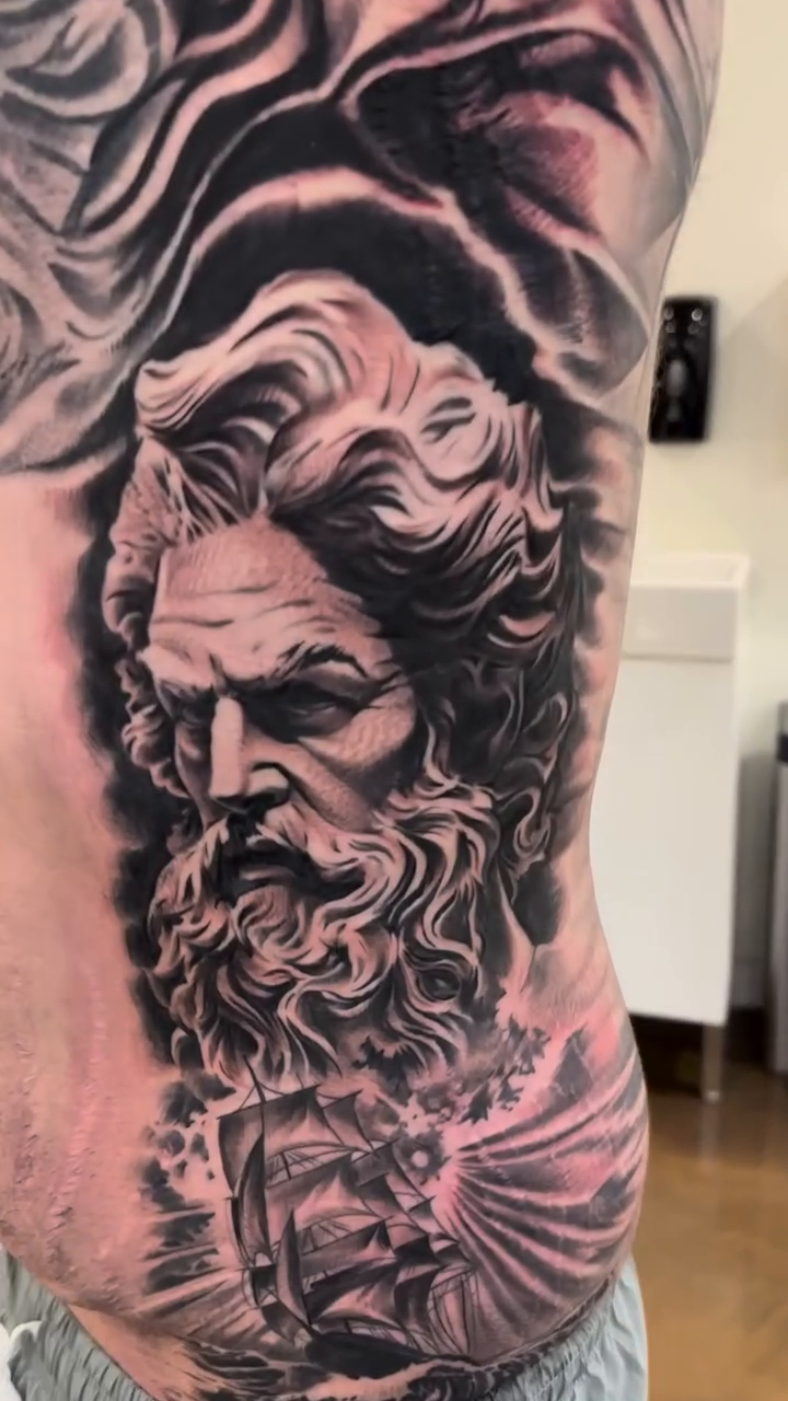 Zeus and skull realism tattoo by Mason Williams
